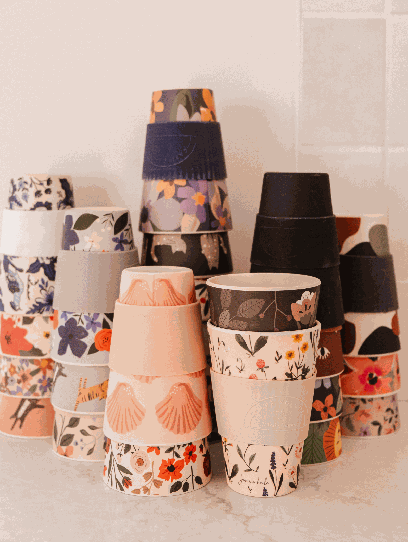 Defect Café Yo Cups with unique imperfections and mismatched lids for eco-friendly hot and cold drinks