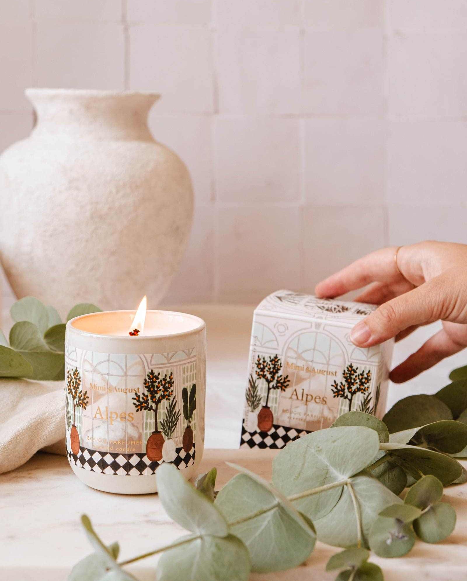 Alpes Reusable Candle with greens, balsam, cedar, and eucalyptus scent in ceramic container