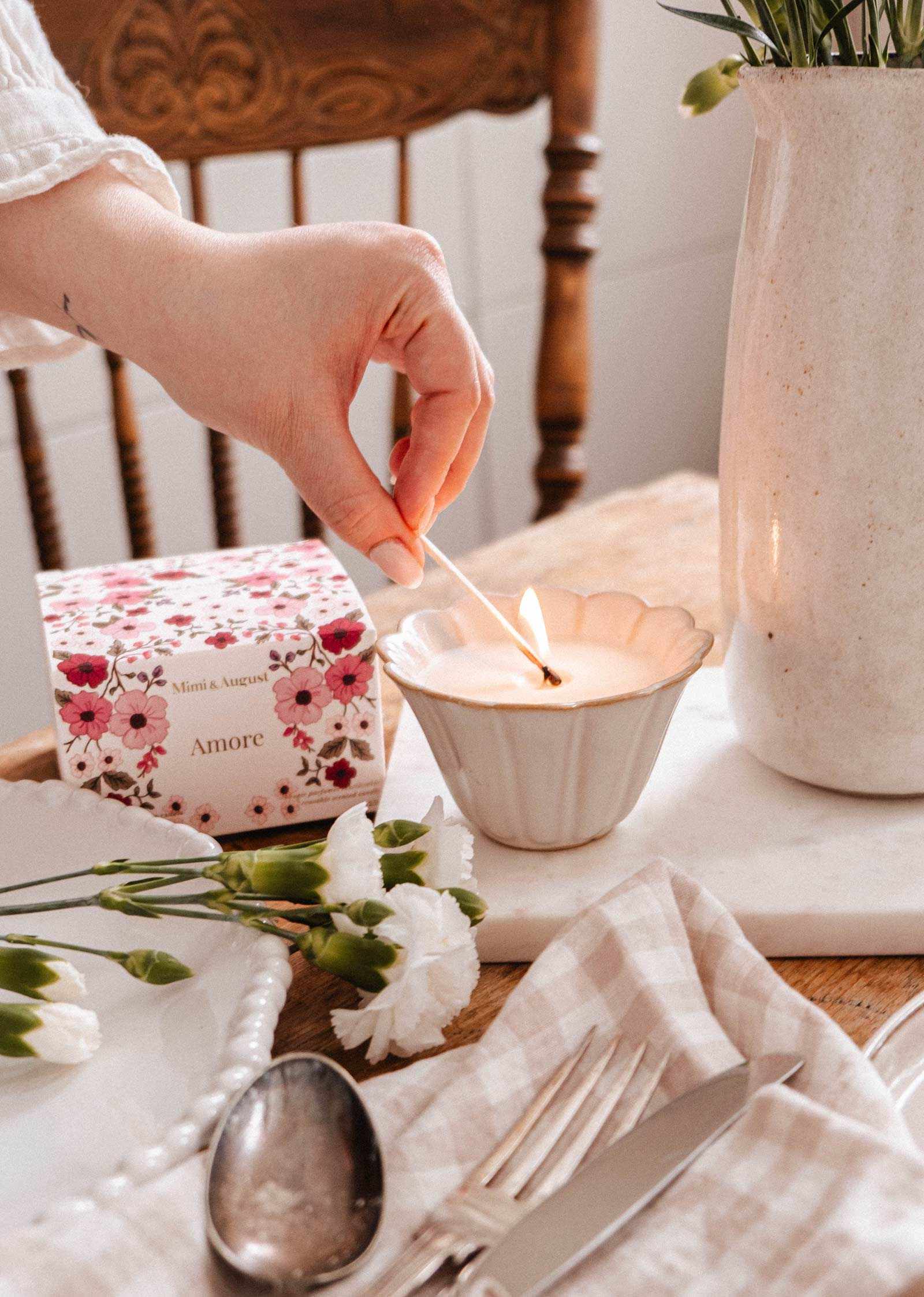 Amore reusable candle in sculpted ceramic jar with white tea, grapefruit, and rose petals scent