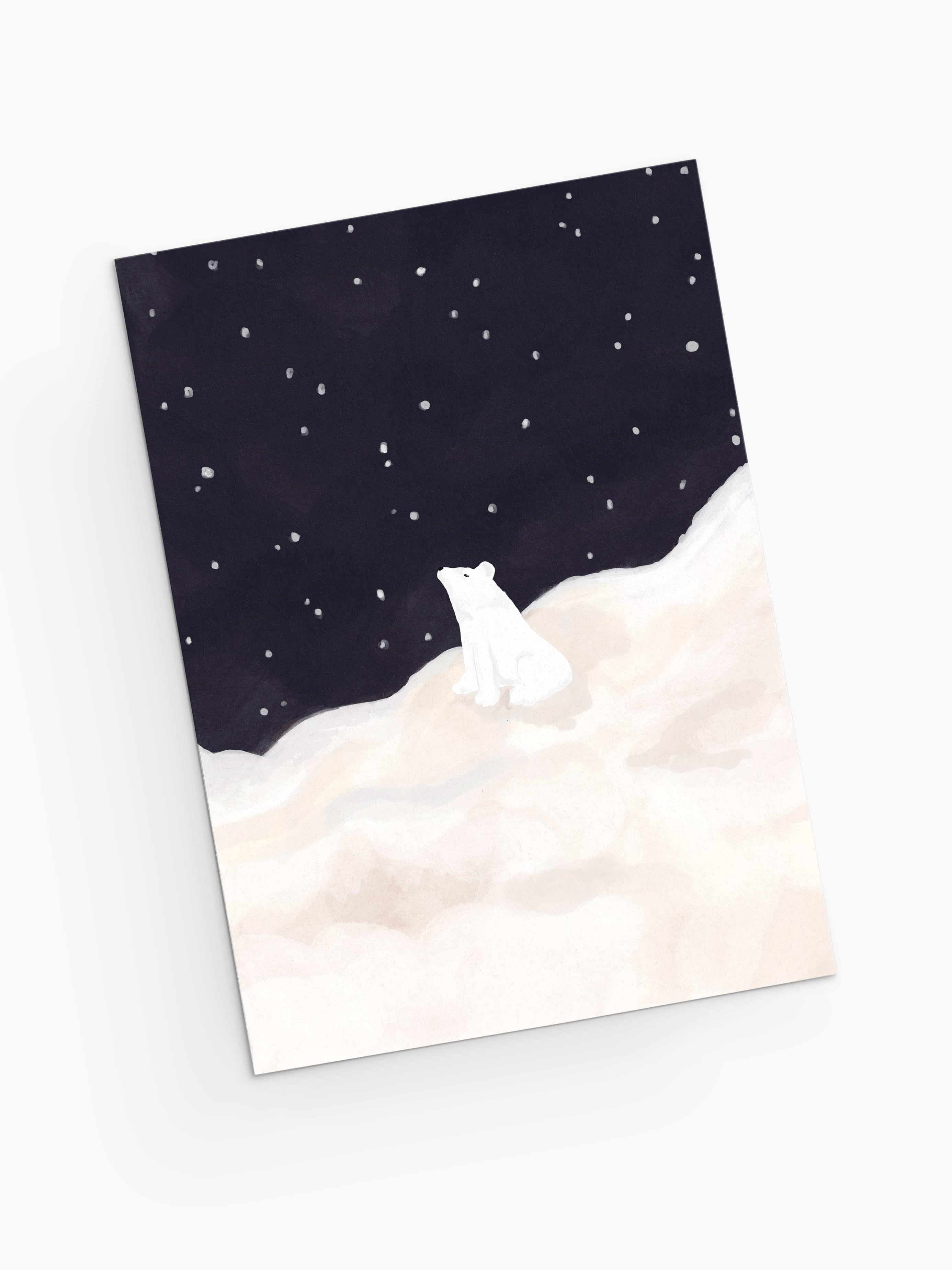 An illustration of a white bear sitting on snowy ground beneath a starry night sky, capturing the cozy charm of Christmas greeting cards in the "Bear-y Merry Wishes Under the Stars" by Mimi & August.
