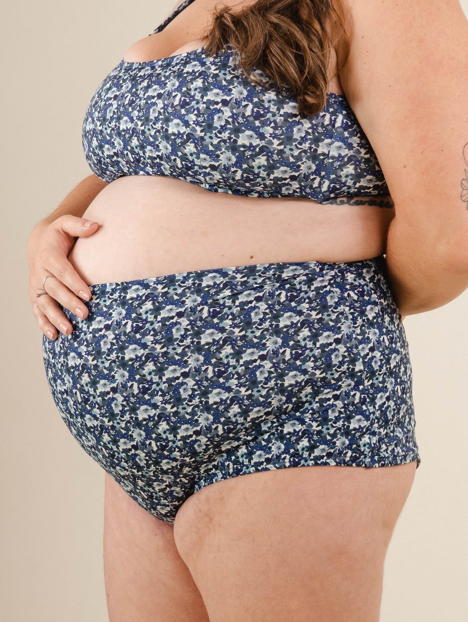 A pregnant woman with a Blue Moonflower Extra High Waist Bikini Bottom