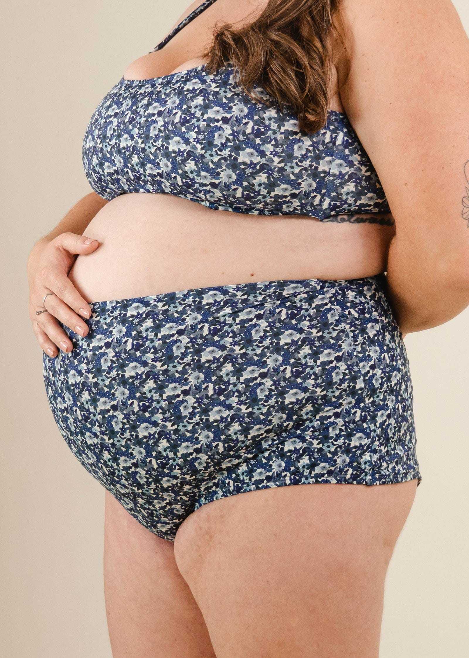 A pregnant woman with a Blue Moonflower Extra High Waist Bikini Bottom