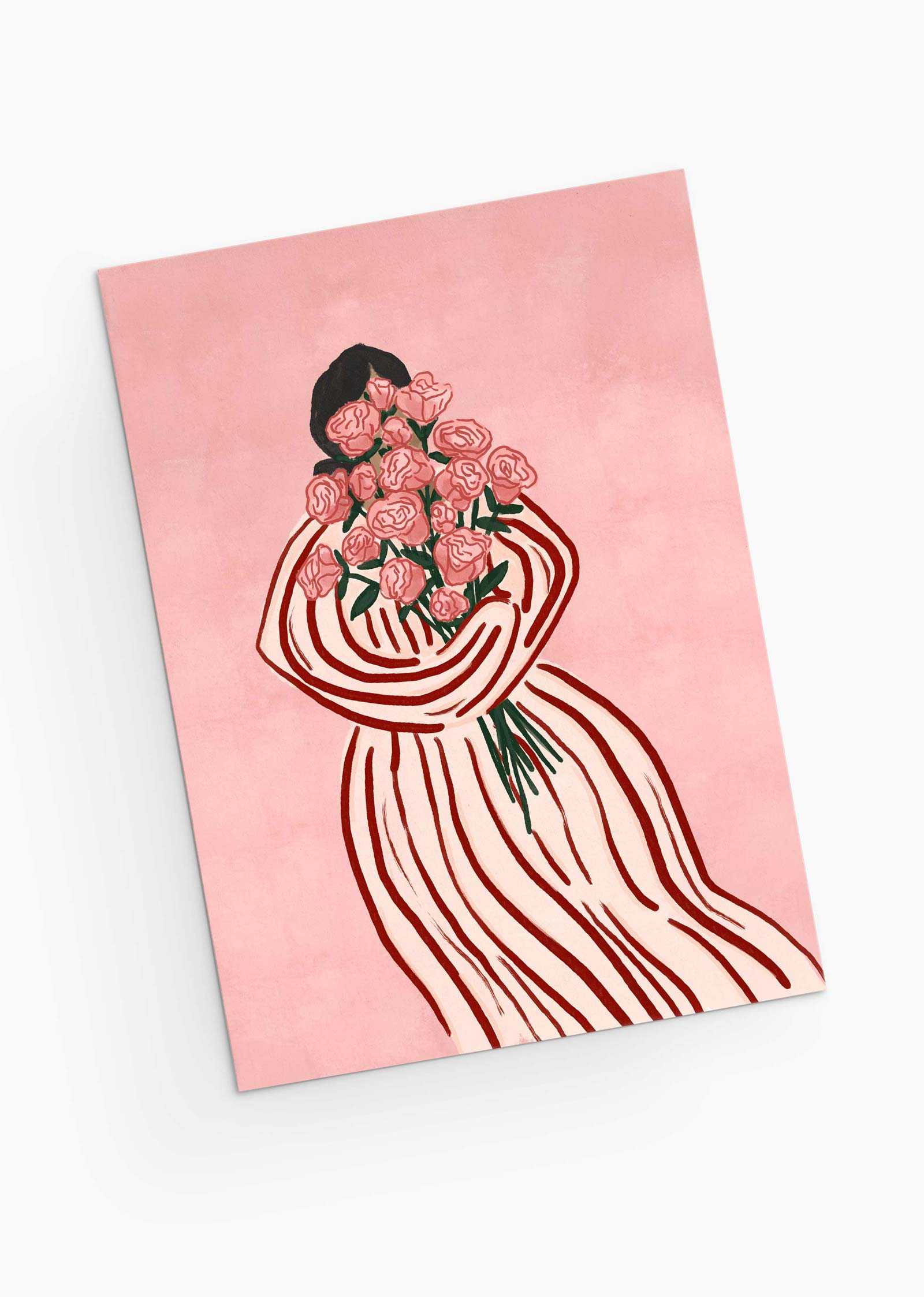 A person in a striped dress holds a bouquet of pink roses on a matching pink background, echoing the elegance and charm of the Bouquet of Roses Greeting Card by Mimi & August. Perfect for sustainable keepsakes, it features floral elegance on recycled paper.