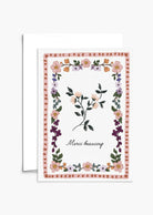 The Floral Thank You Greeting Card by Mimi & August features a vintage floral design with a charming border, central flower, and "Merci beaucoup" in cursive. This blank card is ideal for heartfelt notes and gratitude.
