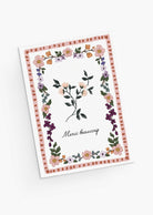 The Floral Thank You Greeting Card by Mimi & August features a vintage flower design with a delicate border and "Merci beaucoup" in cursive on recycled paper—perfect for expressing gratitude.
