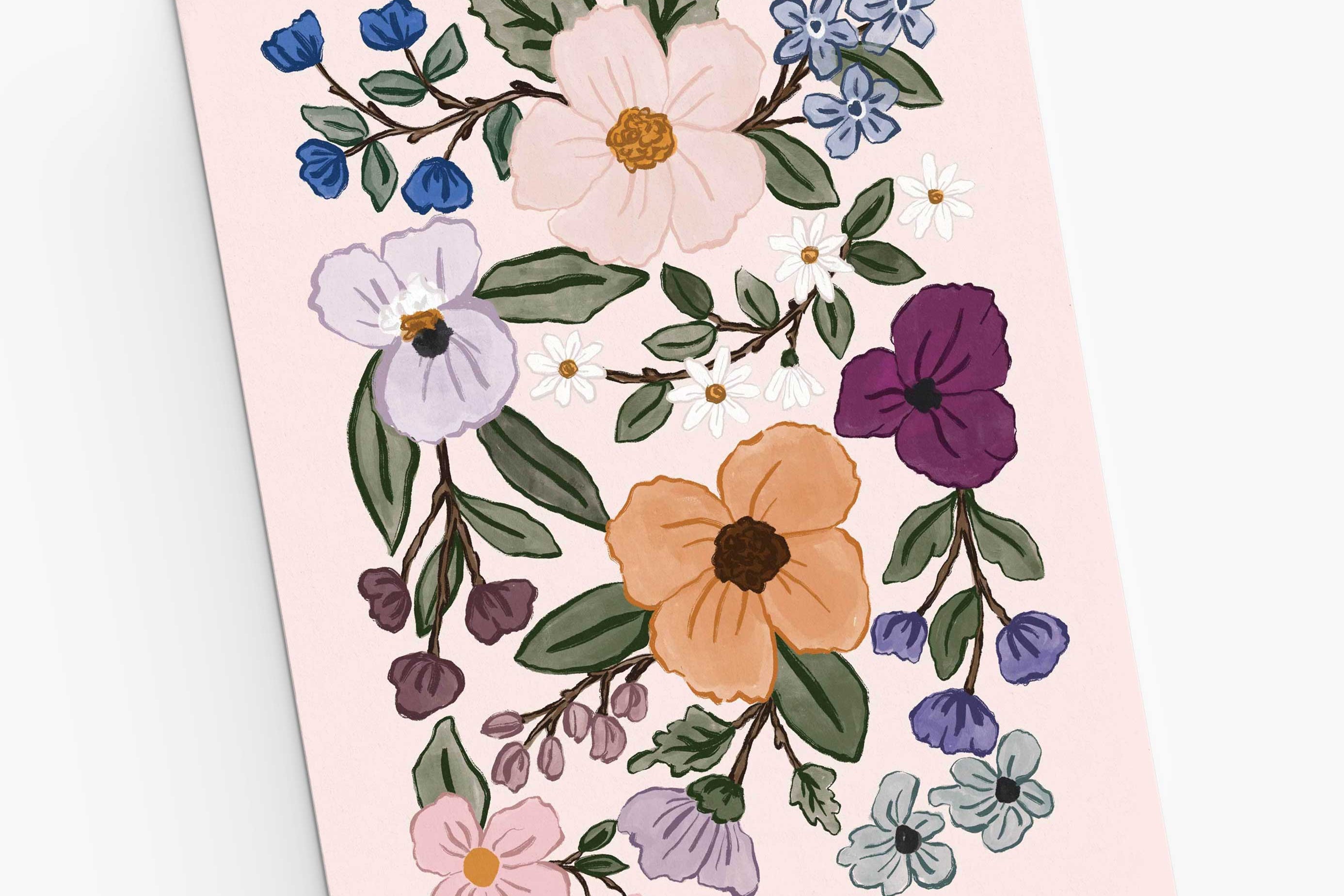 The Field of Flowers Greeting Card by Mimi & August is a pink recycled paper card featuring colorful flowers and green leaves decoratively illustrated on the front.