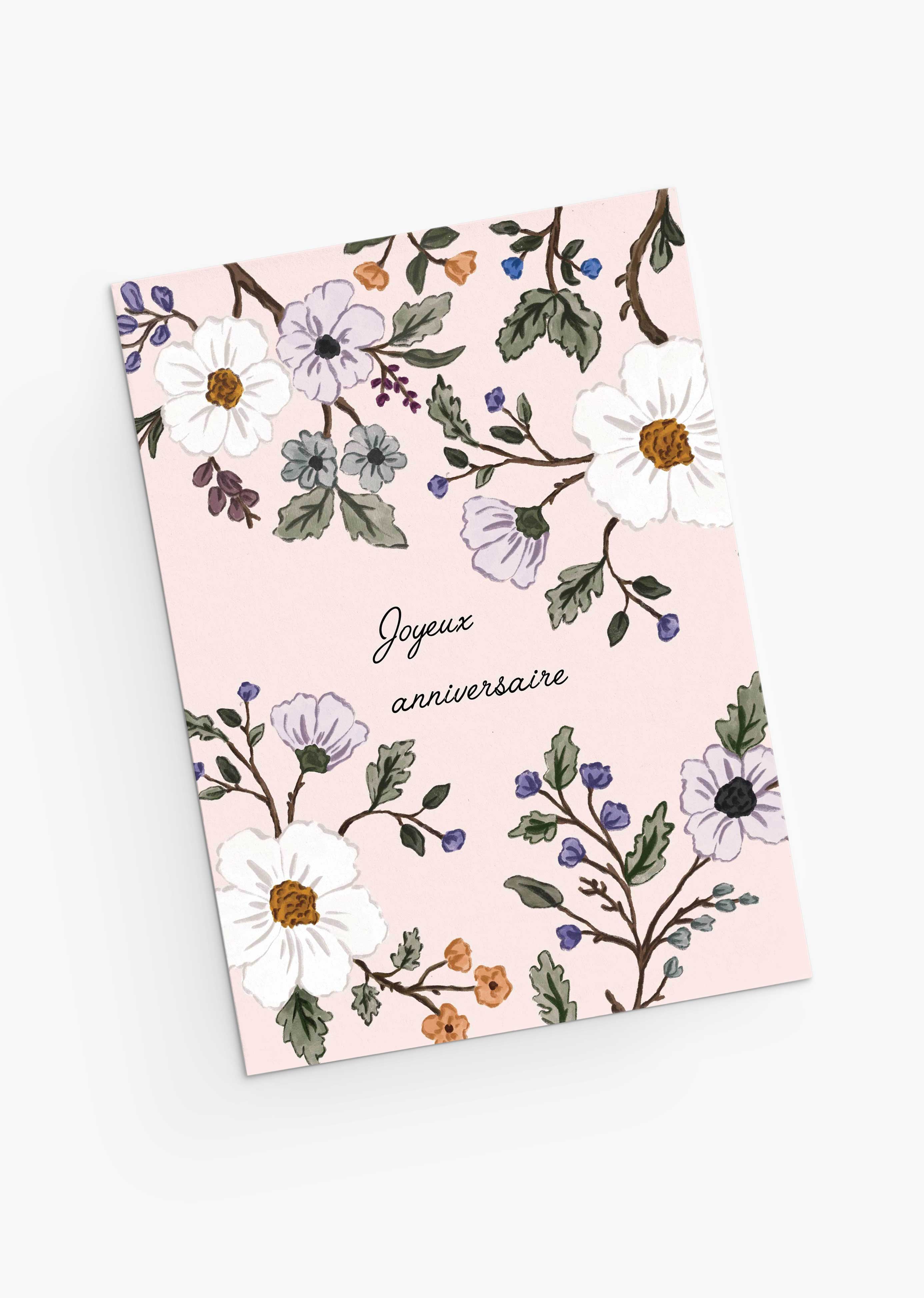The Mimi & August Botanical Birthday Greeting Card features blush pink hues, floral illustrations, and "Joyeux anniversaire" in French—perfect as a wildflower-inspired birthday card.