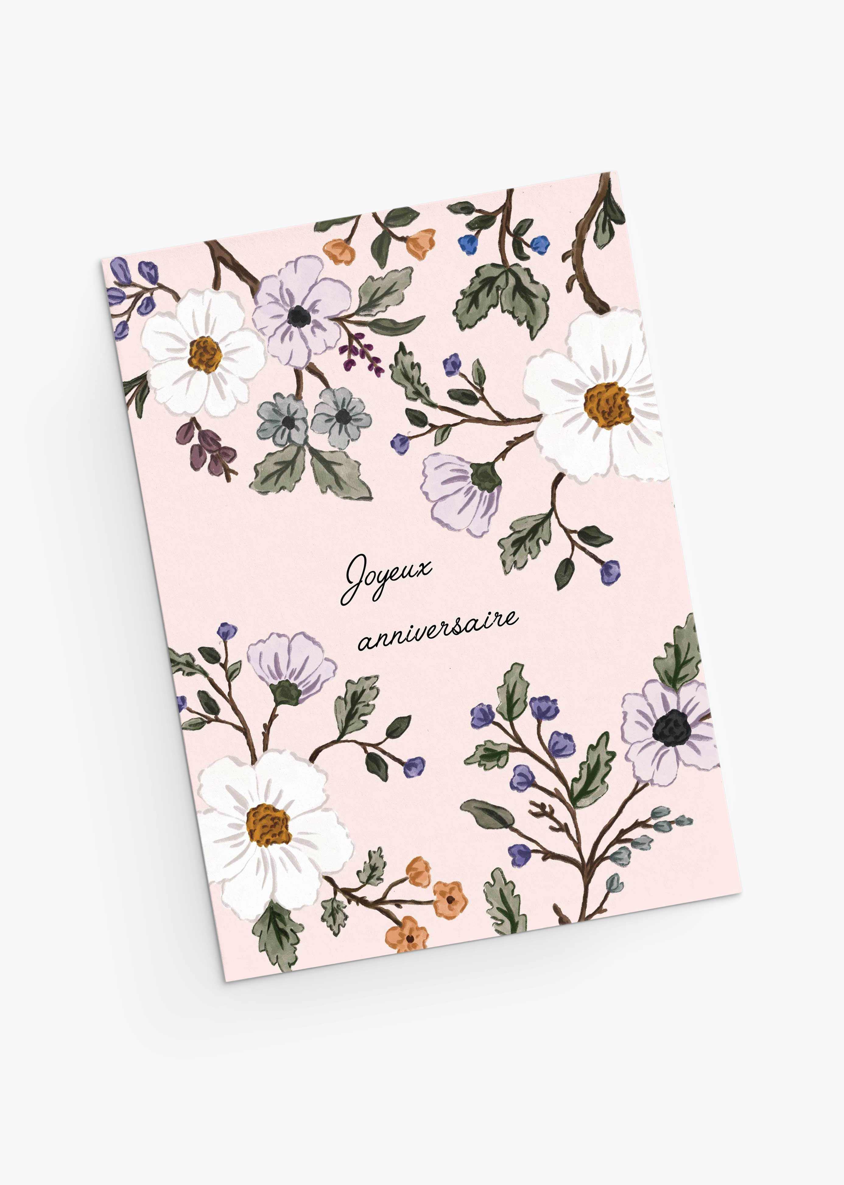 The Mimi & August Botanical Birthday Greeting Card features blush pink hues, floral illustrations, and "Joyeux anniversaire" in French—perfect as a wildflower-inspired birthday card.