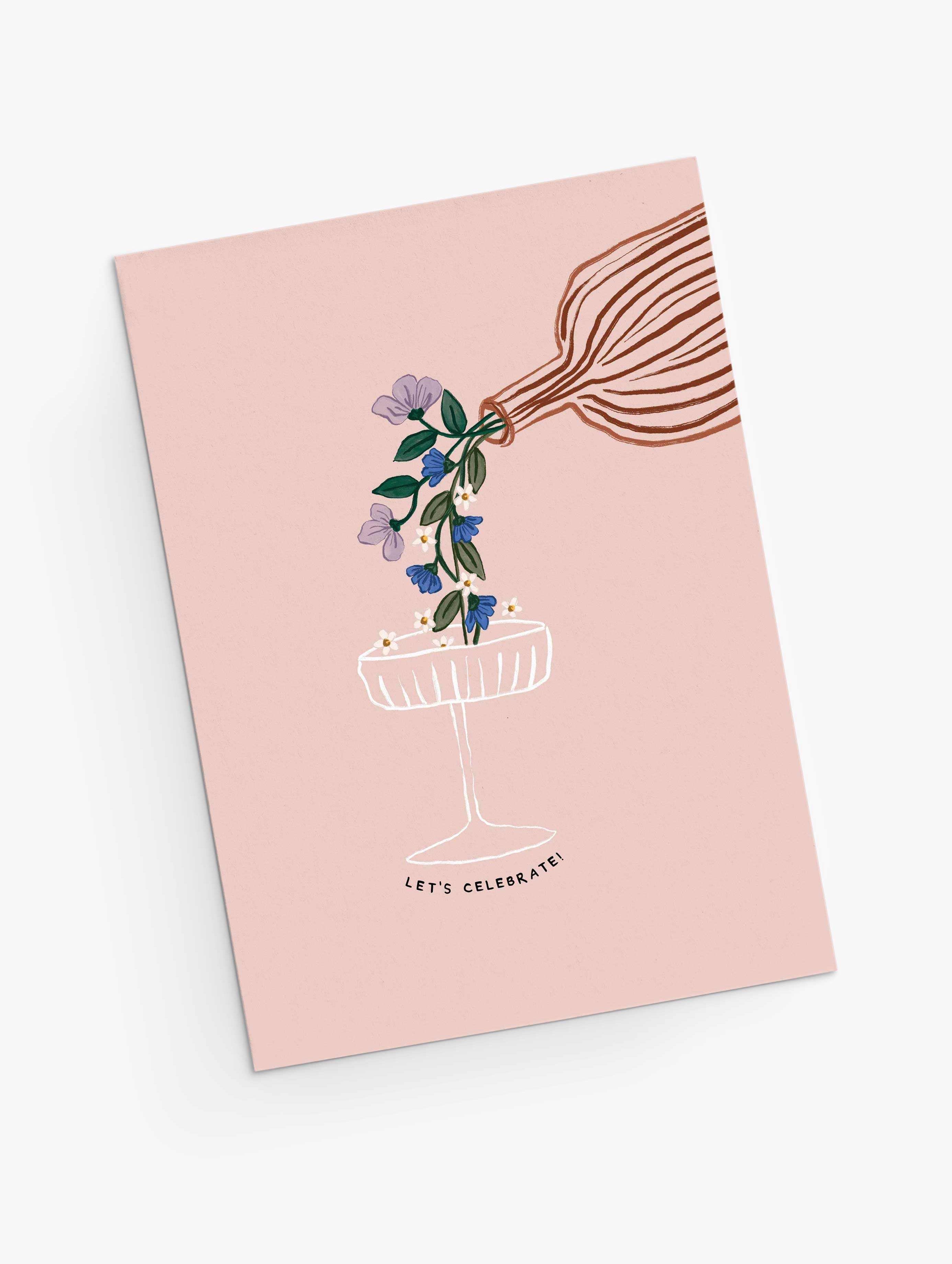 Let's Celebrate Greeting Card with whimsical bouquet flowing into a coupe glass on soft pink background