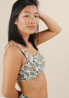 A woman in a Lima Herboria Bralette Bikini Top smiling for a picture.