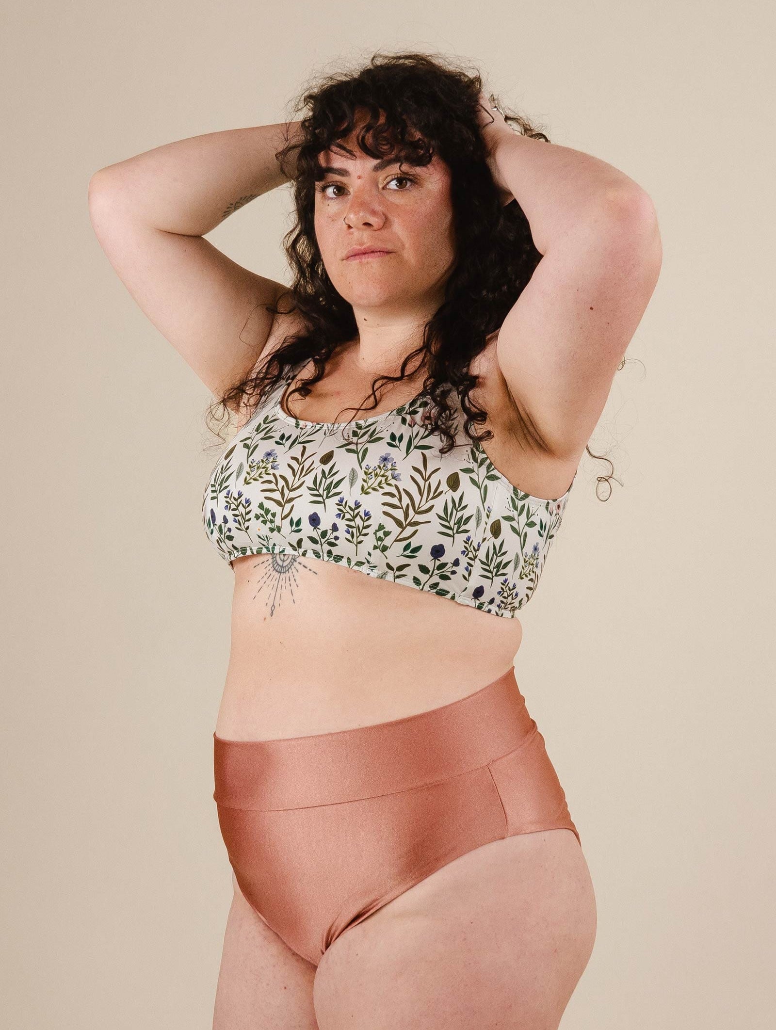 A woman in a Floral Bralette Bikini Top with high waisted bikini