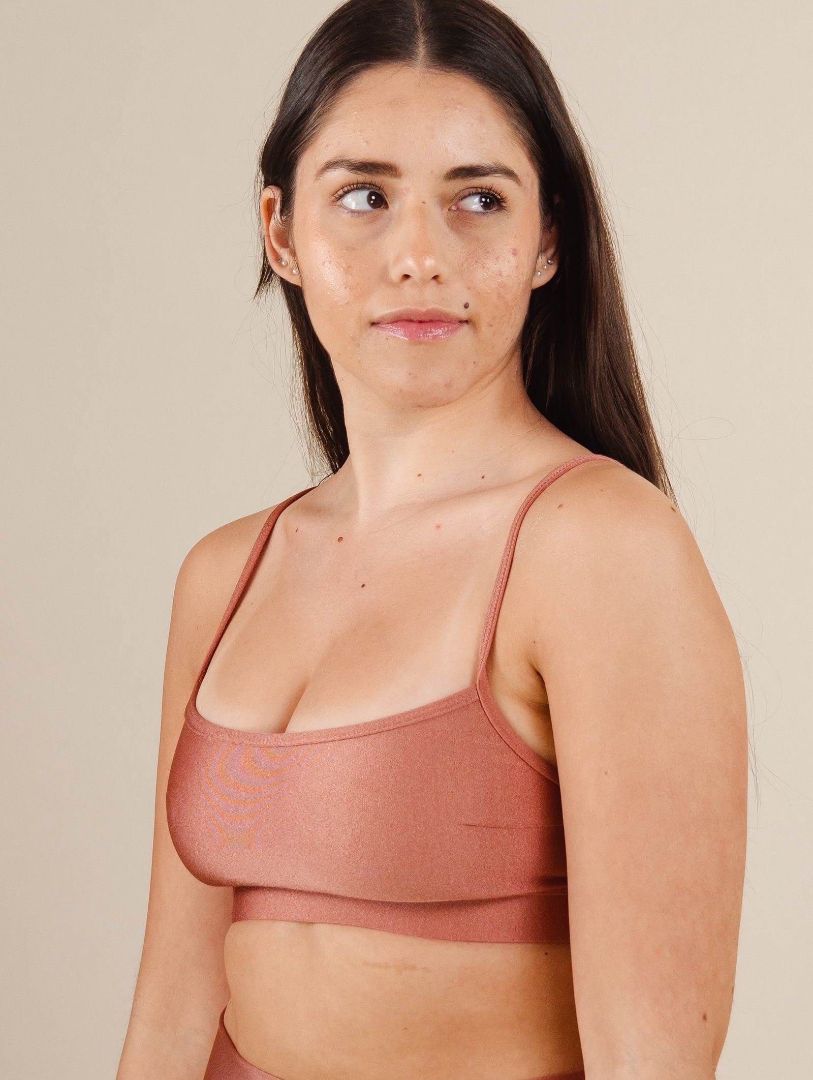 A woman in a Mimi and August Coral Bikini Top Print