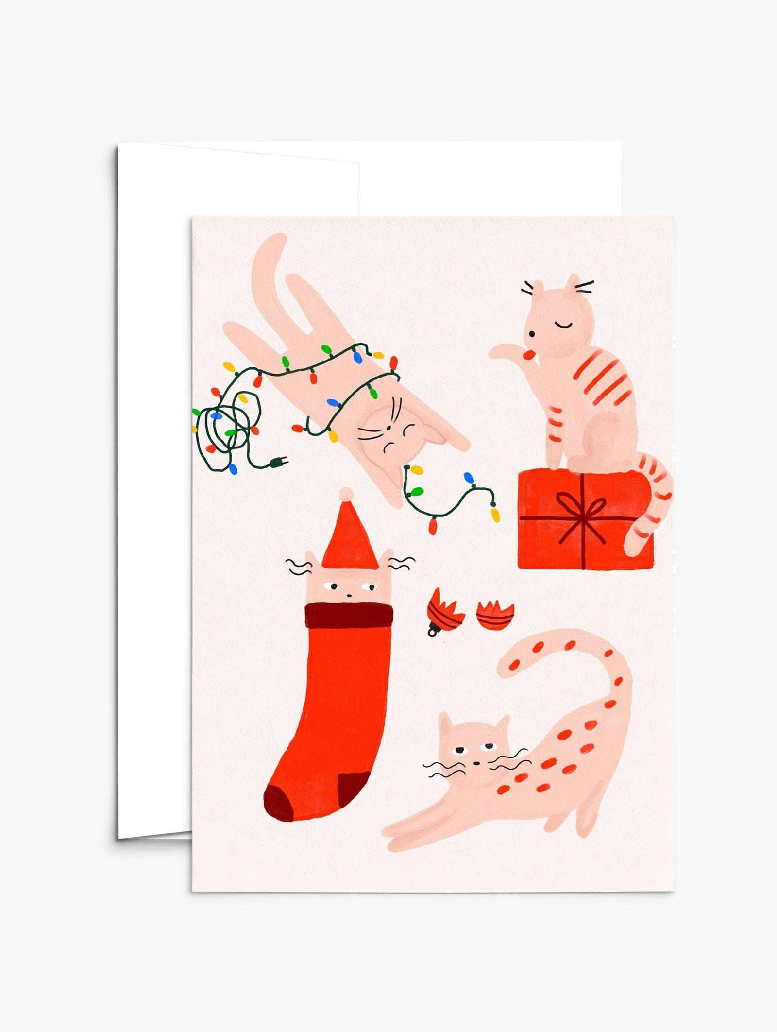 Four merry kitties playing with Christmas lights and gifts on a festive greeting card