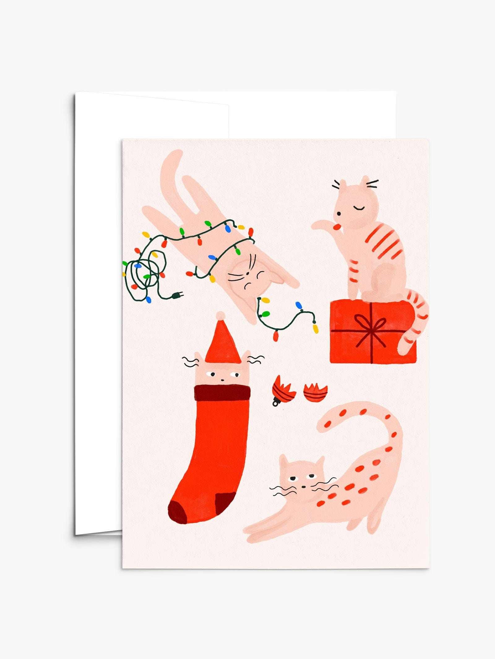 Four merry kitties playing with Christmas lights and gifts on a festive greeting card