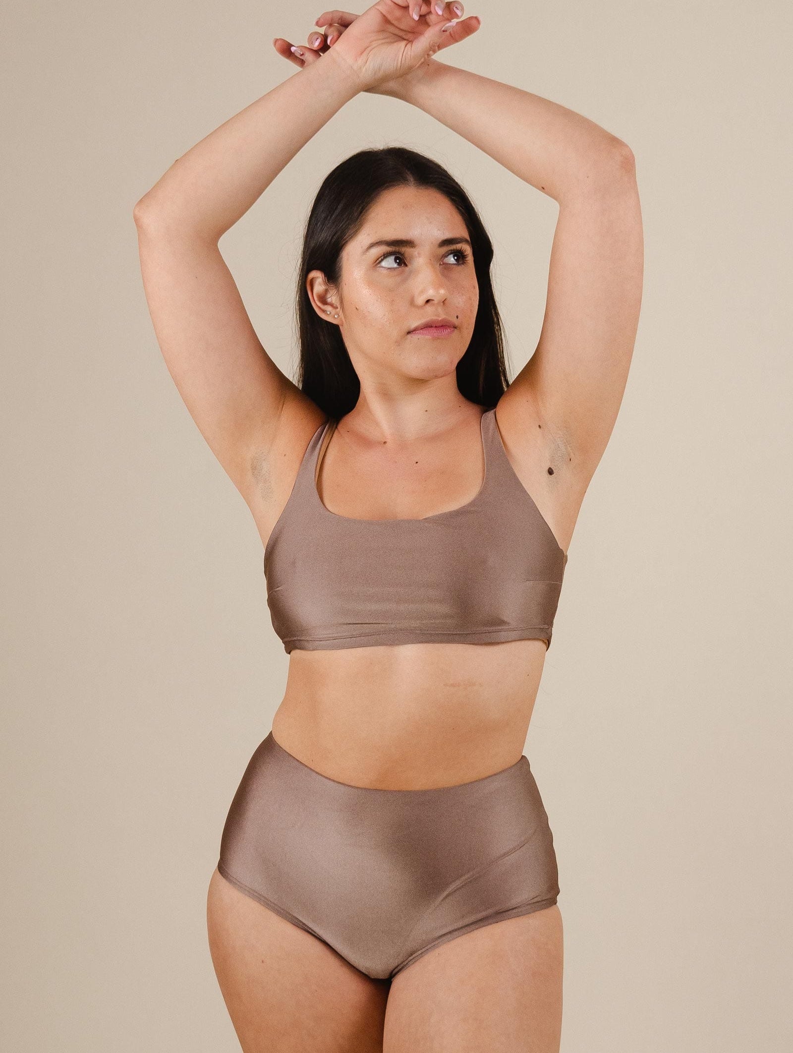 A south american woman wearing the paloma Dunes High Waist Bikini Bottom by mimi and august