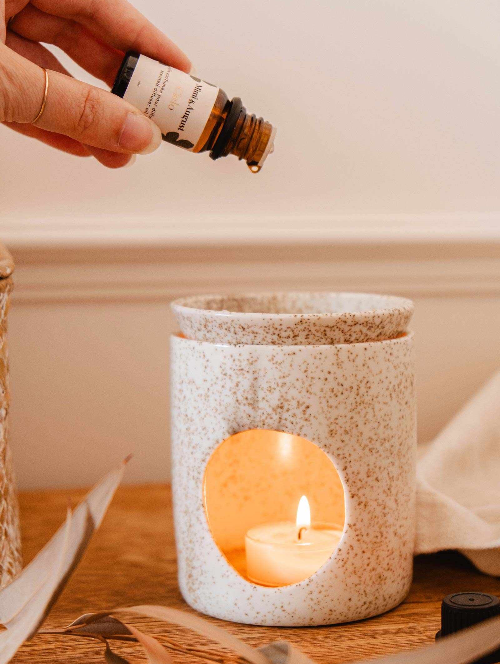Bottle of forest scented oil labeled Foresta with fir needles, cedarwood, and green moss aroma