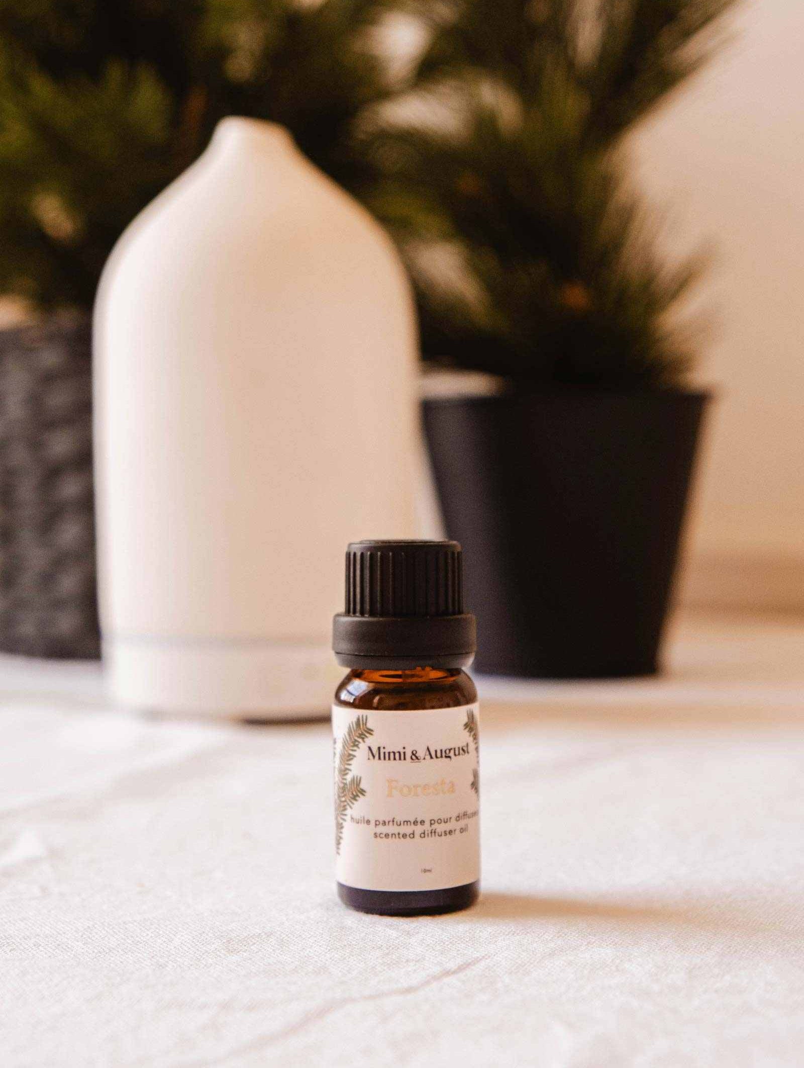 Bottle of forest scented oil Foresta with fir needle, cedarwood, and green moss scent for diffusers