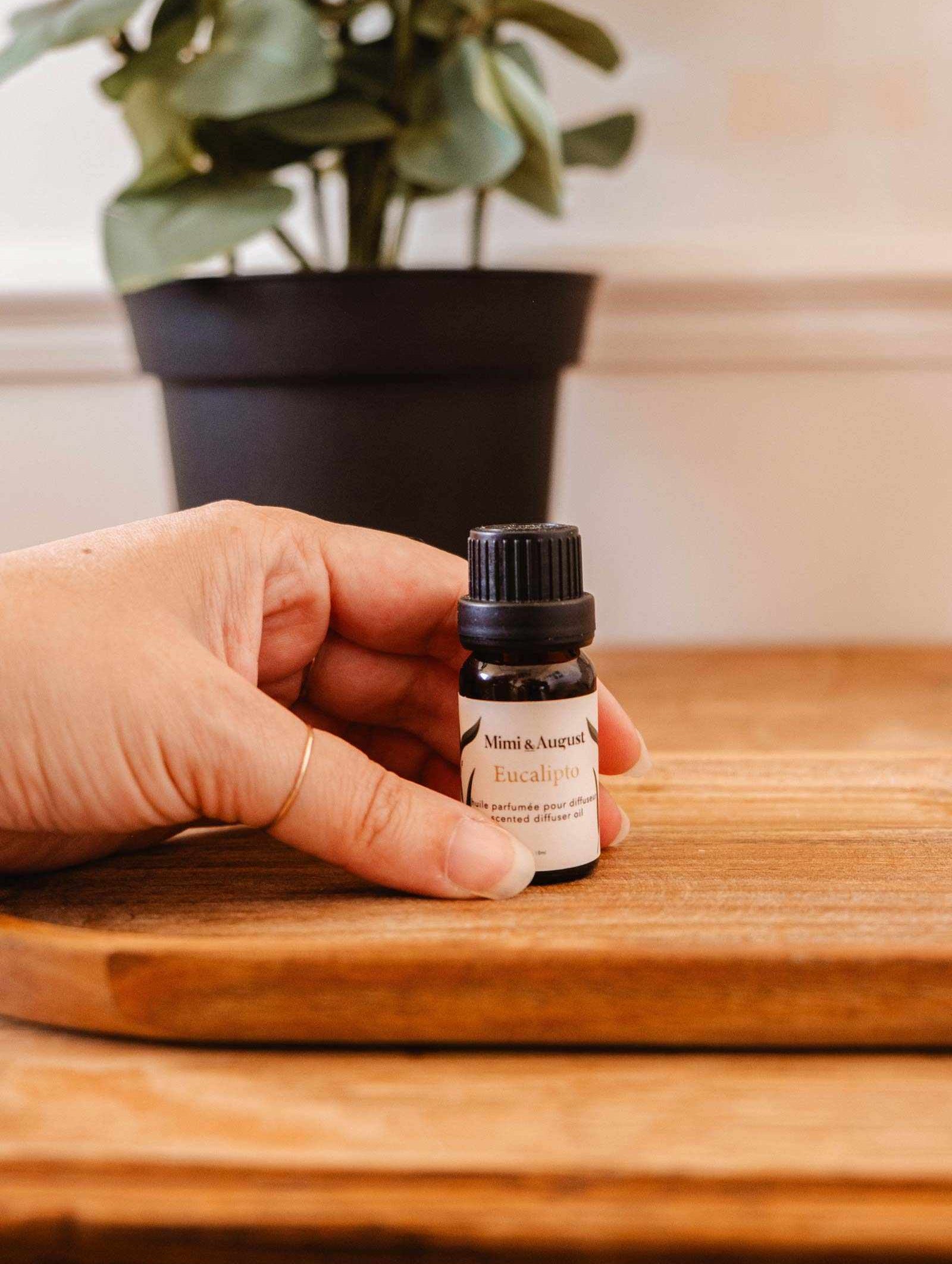 Eucalipto scented oil bottle with eucalyptus leaves for refreshing, relaxing aroma