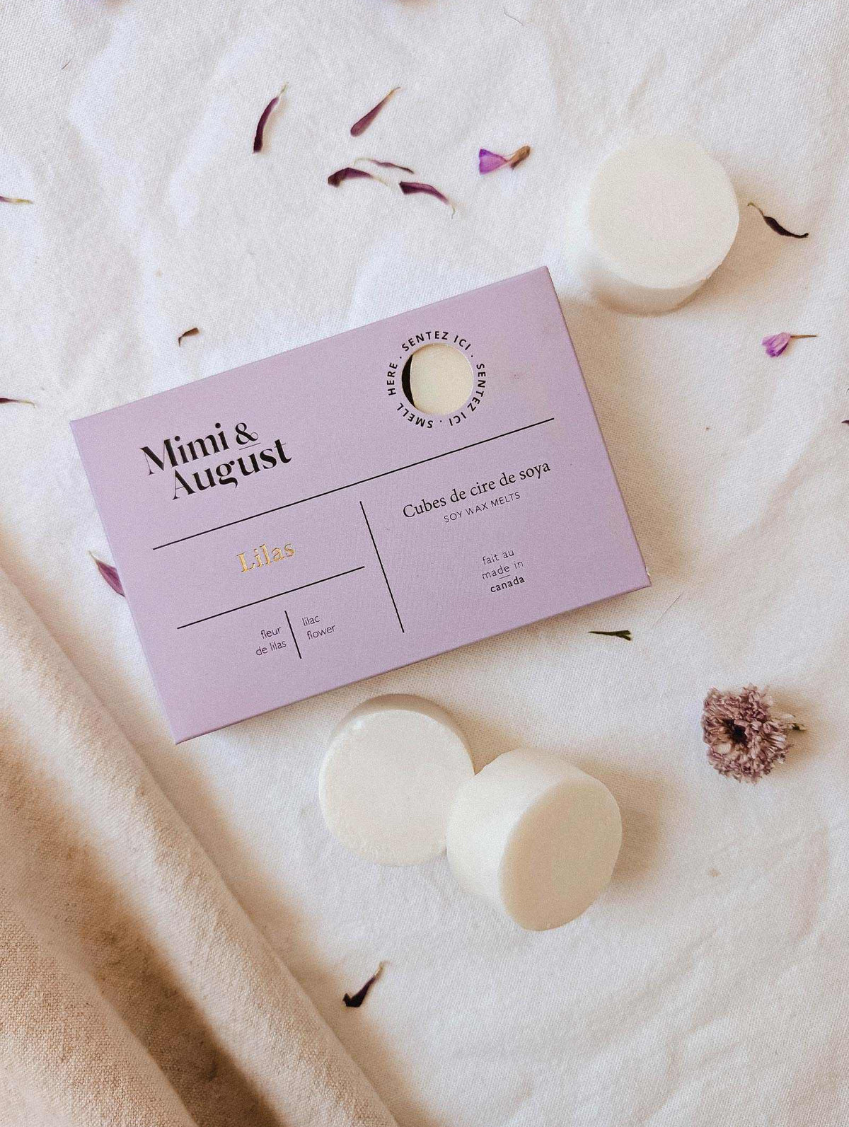 Lilac soy wax melts releasing soothing floral fragrance in a cozy home setting