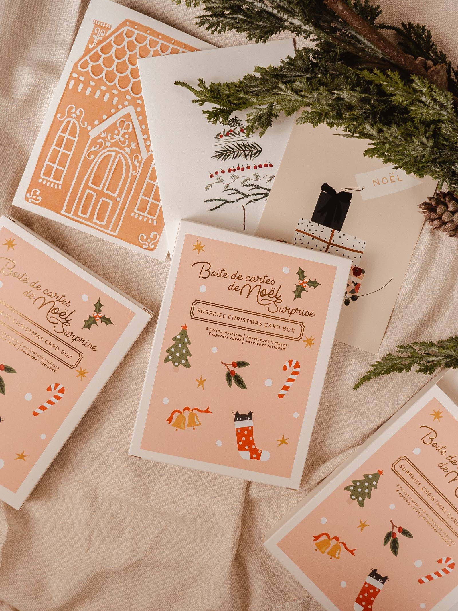 Christmas mystery card box, cute sticker with tree, mistletoe, bells and candy cane. There is 6 greeting card inside the box. By Mimi & August