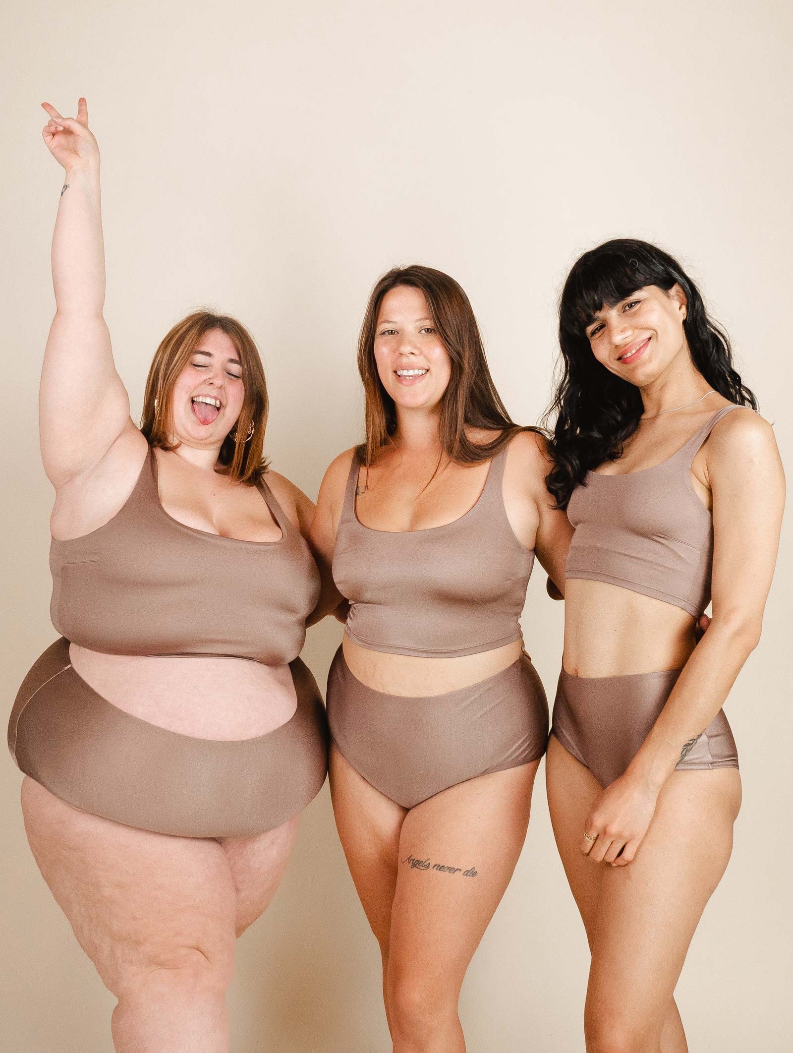 Three women posing for a photo in mimi and august's Dunes Bralette Bikini Top.