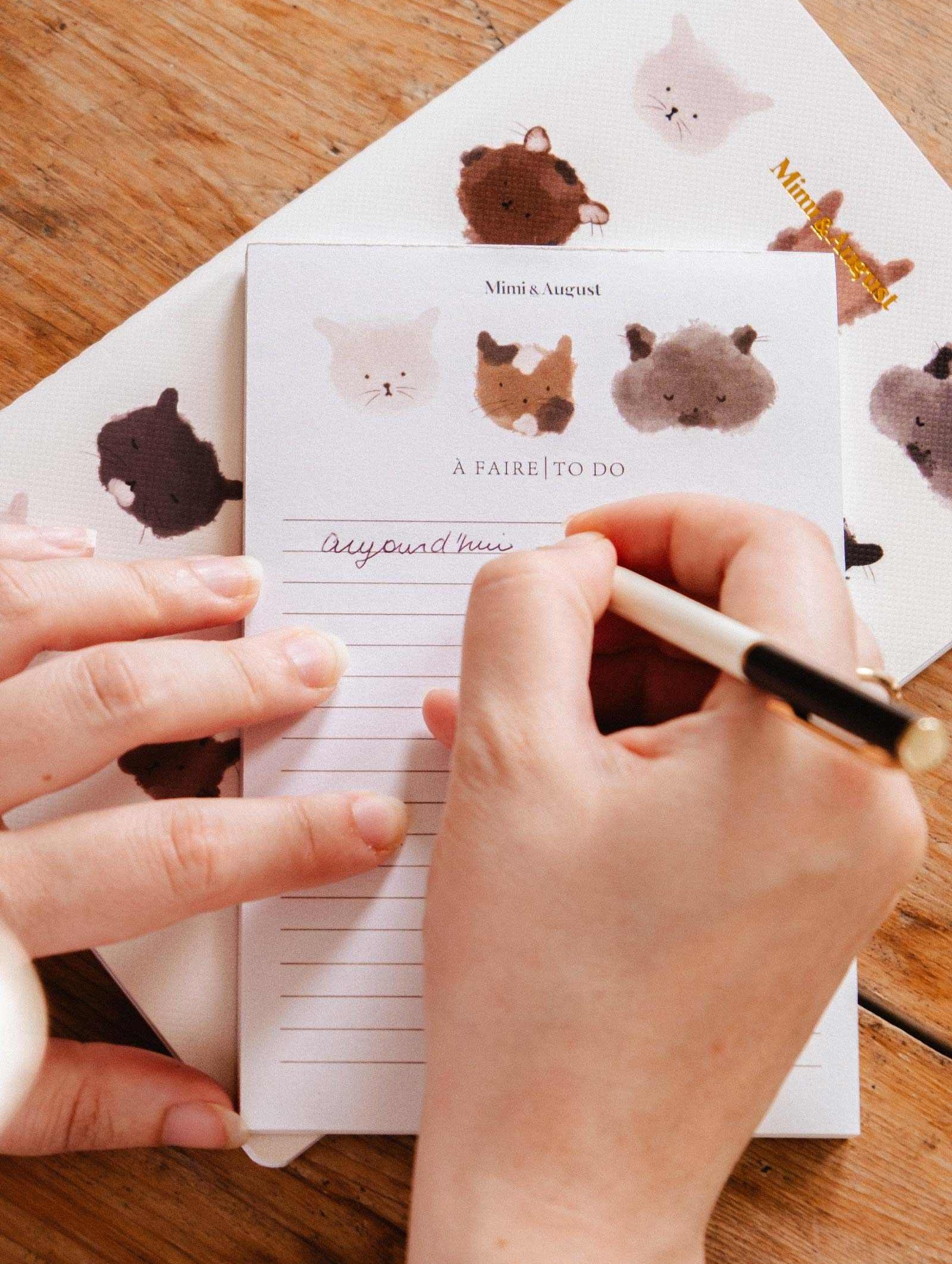 Purrfect - Notepad with three illustrated kitty faces and clean layout for daily notes