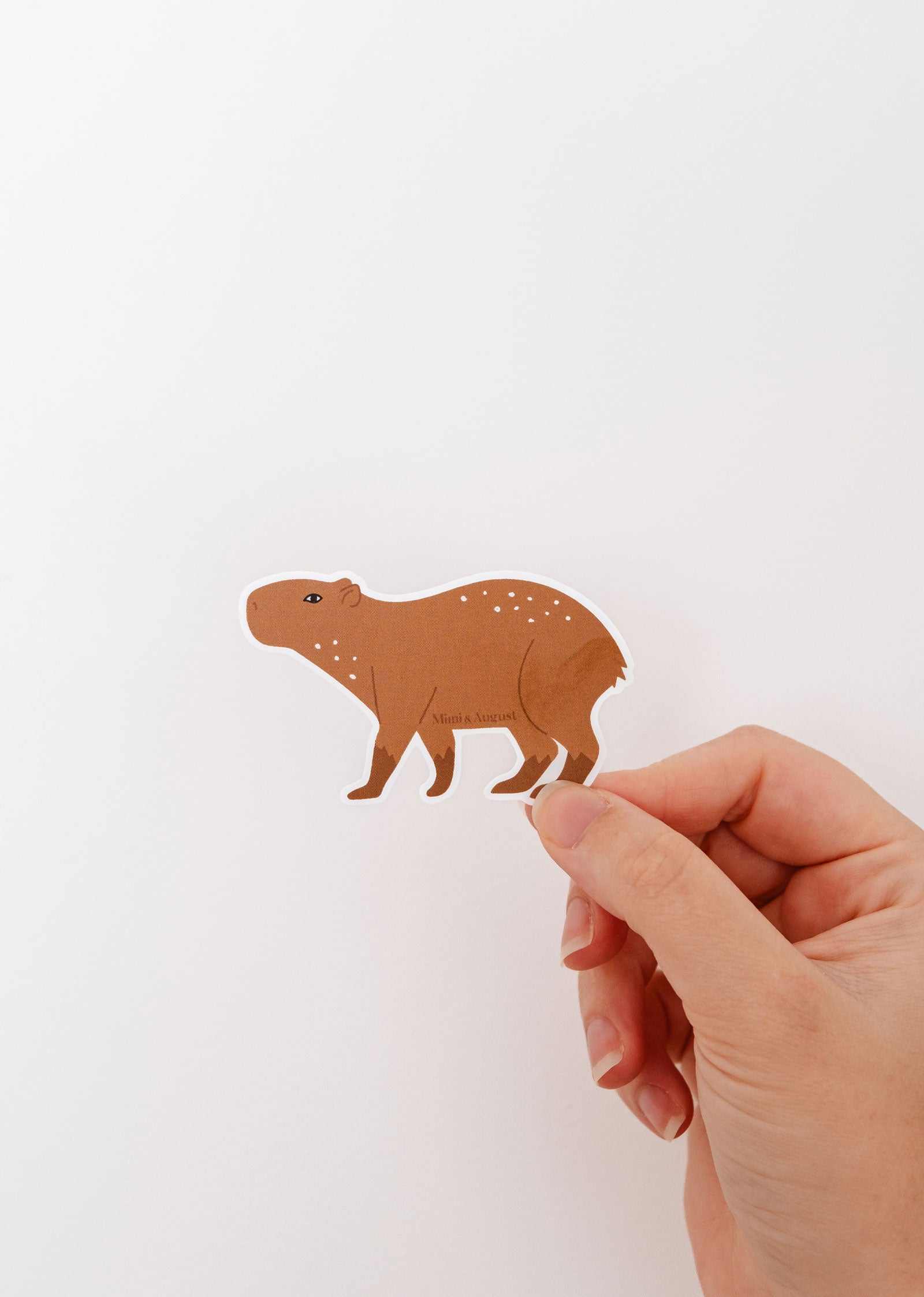 Cute capybara vinyl sticker with white border, durable and waterproof for laptops and water bottles