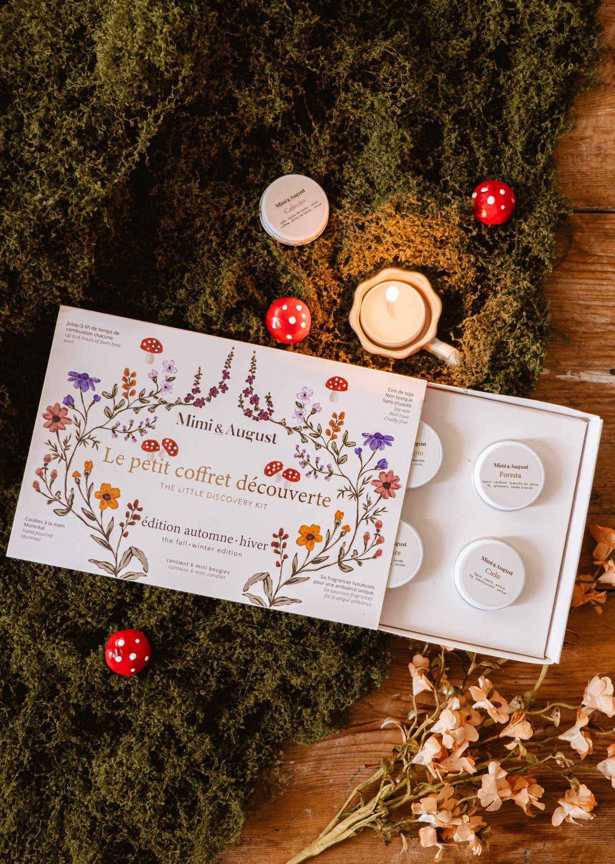 fall candle gift set with six soy tealights in a floral illustrated winter discovery box