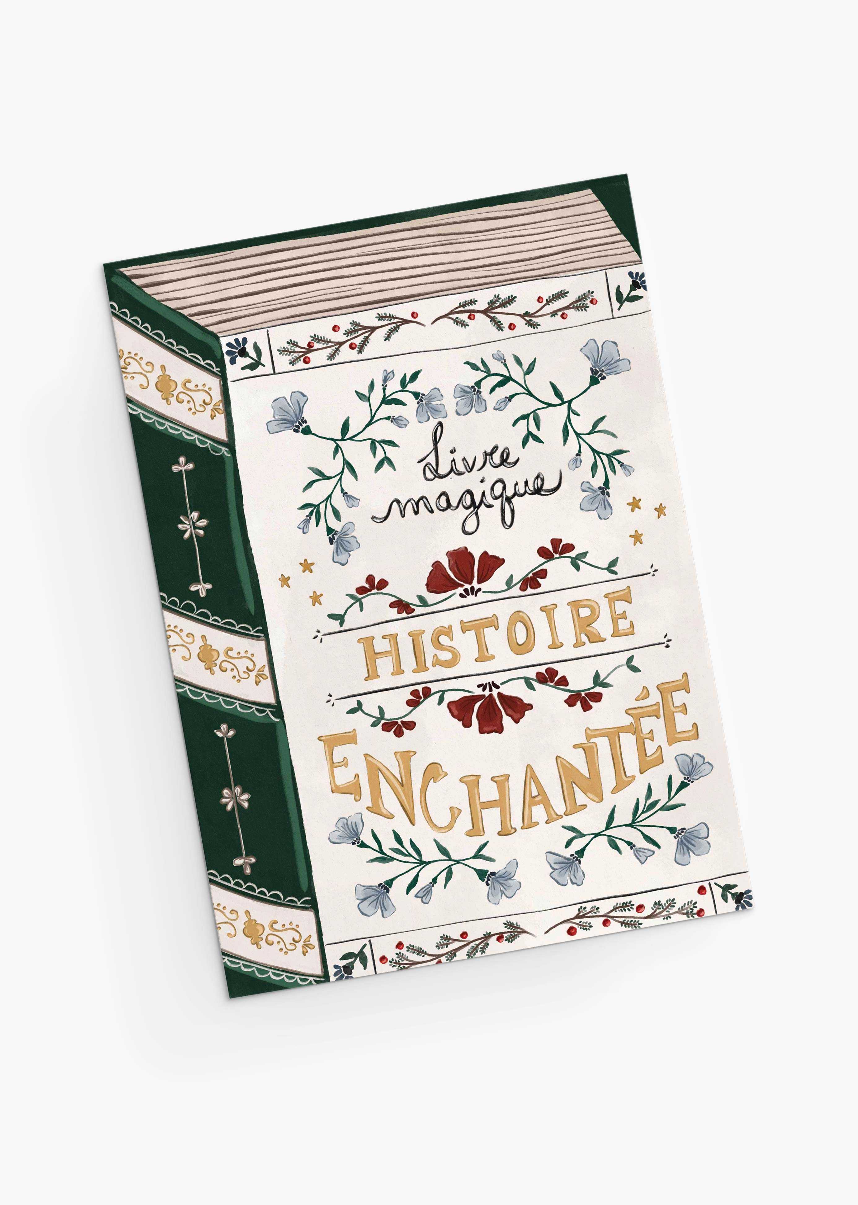 An eco-friendly Christmas greeting card by Mimi & August, "Enchanted Book," features ornate floral designs and decorative gold and black lettering on the cover, printed on recycled paper.