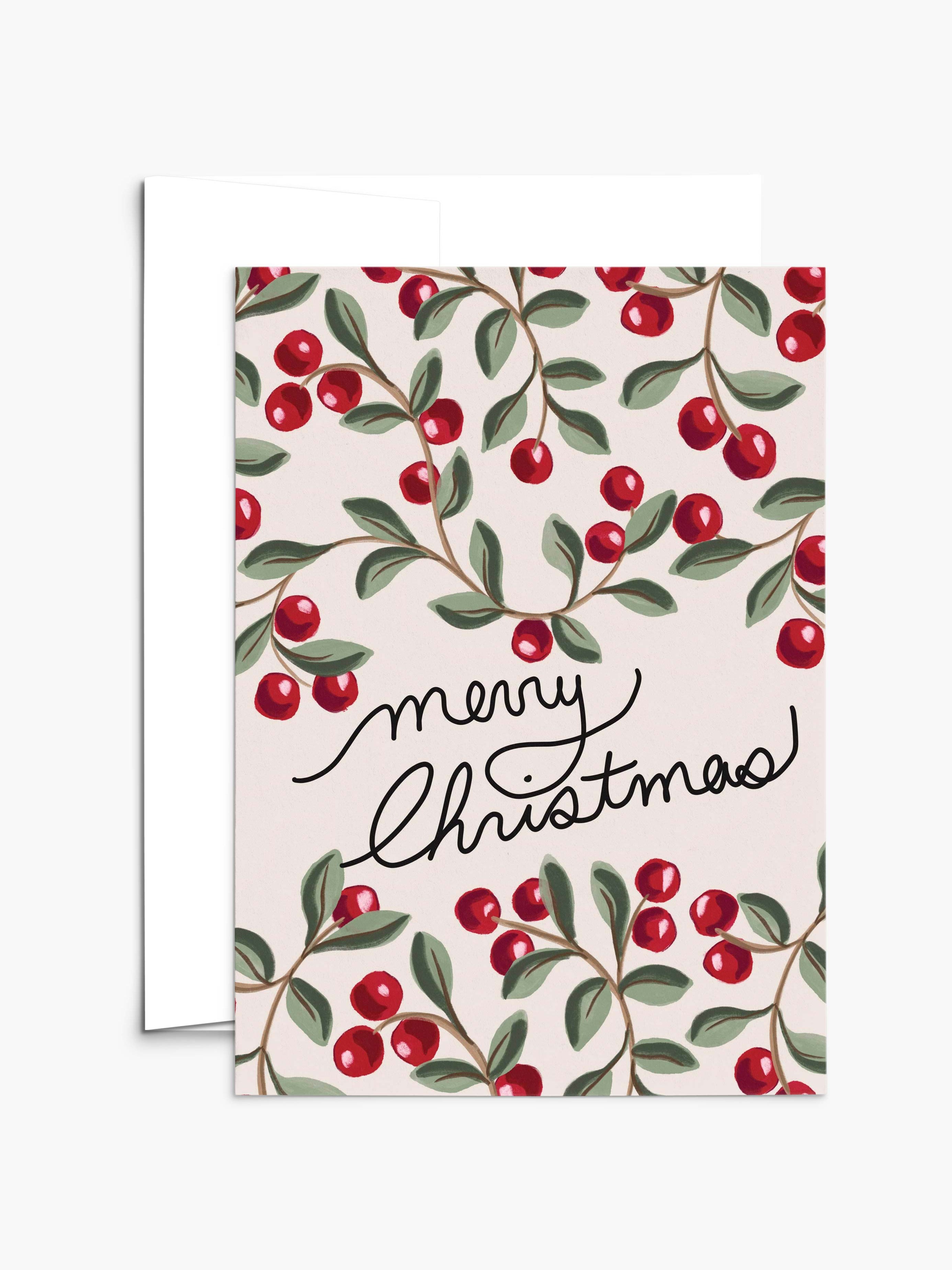 The Merry Christmas Greeting Card by Mimi & August features "Merry Christmas" in cursive with red berries and green leaves on a light background. Printed on recycled paper, it's blank inside for your message.