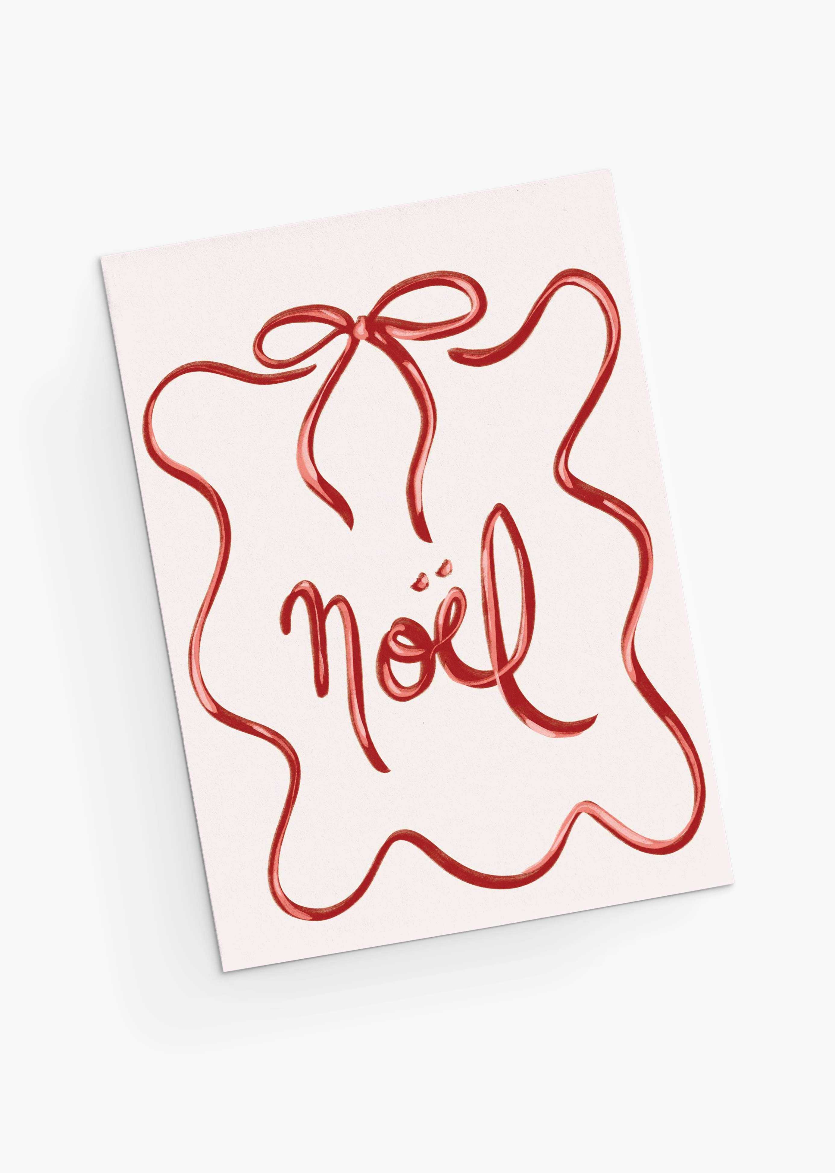 The Mimi & August Christmas Bow Greeting Card features "Noël" in red cursive, framed by a red squiggly ribbon like a gift bow. Printed on recycled paper, it's blank inside for your personal message.