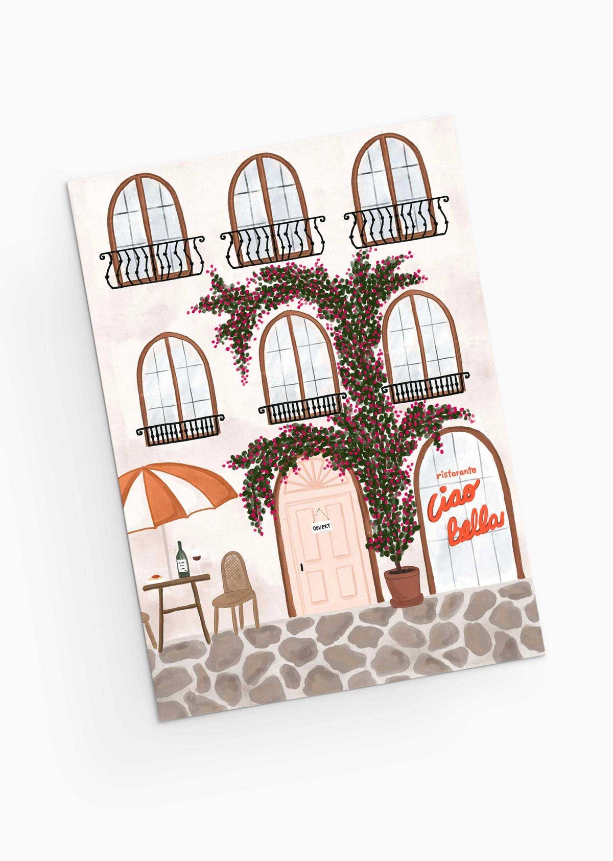 Capture a charming Italian cafe scene with a pink door, large windows, and blooming vines on the Ristorante Greeting Card by Mimi & August. Featuring an outdoor table under an umbrella by the "Ciao Bella" sign, it's perfect for greeting cards or restaurant themes. Printed on recycled paper for eco-friendliness.