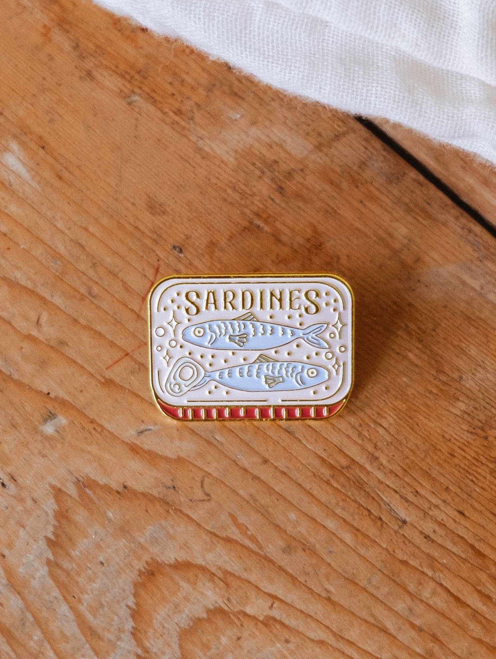 Cozy Sardines Enamel Pin gold tone brass with quirky tin design celebrating togetherness