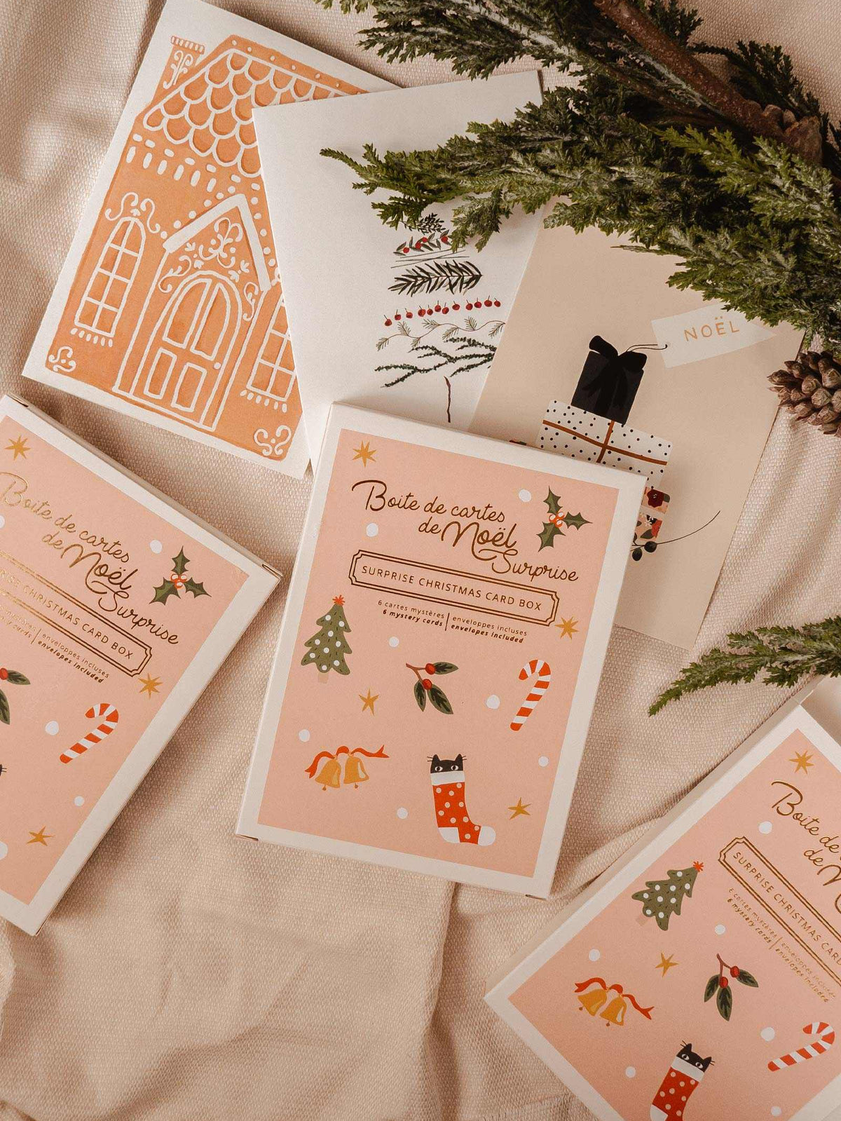 Christmas mystery card box, cute sticker with tree, mistletoe, bells and candy cane. There is 6 greeting card inside the box. By Mimi & August