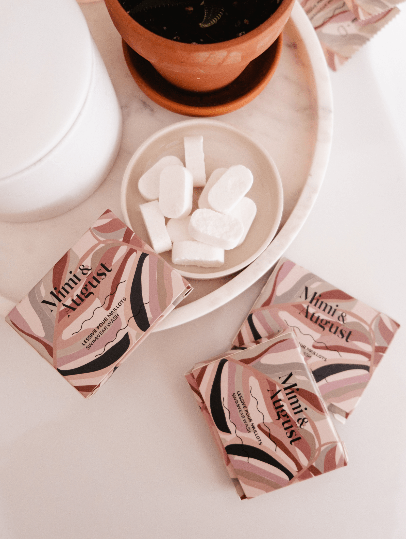 A colorful box with 10 tablets of swim soap by mimi and august