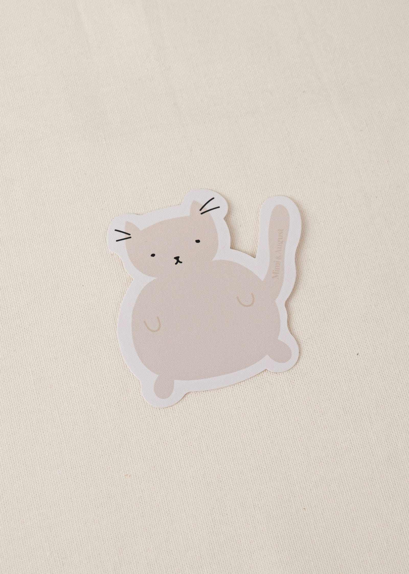 Charlotte vinyl sticker featuring a cute cat illustration with a white border on a beige background