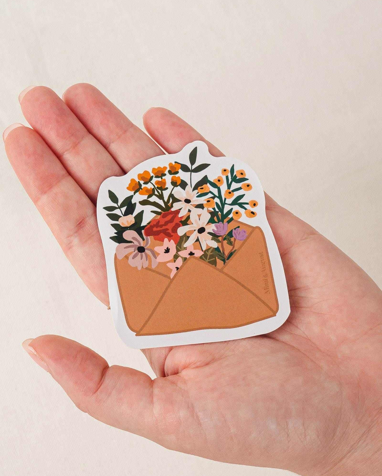 Flower Envelope vinyl sticker with colorful flowers in brown envelope held in hand