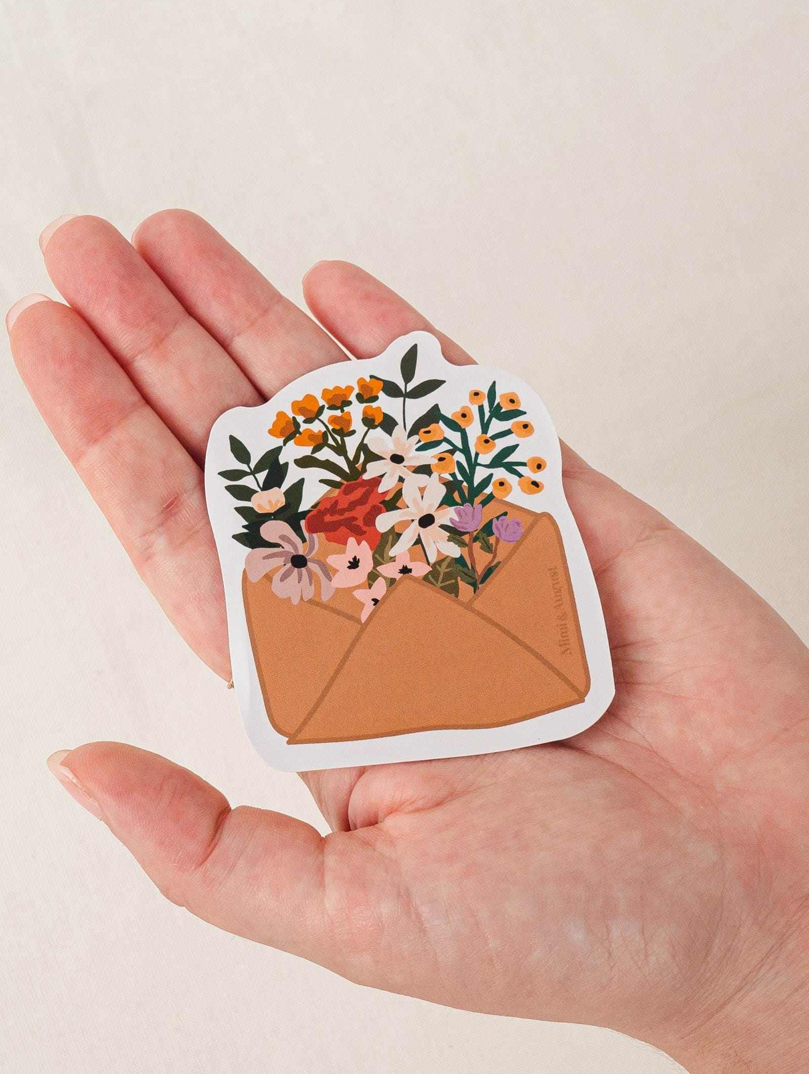 Flower Envelope vinyl sticker with colorful flowers in brown envelope held in hand