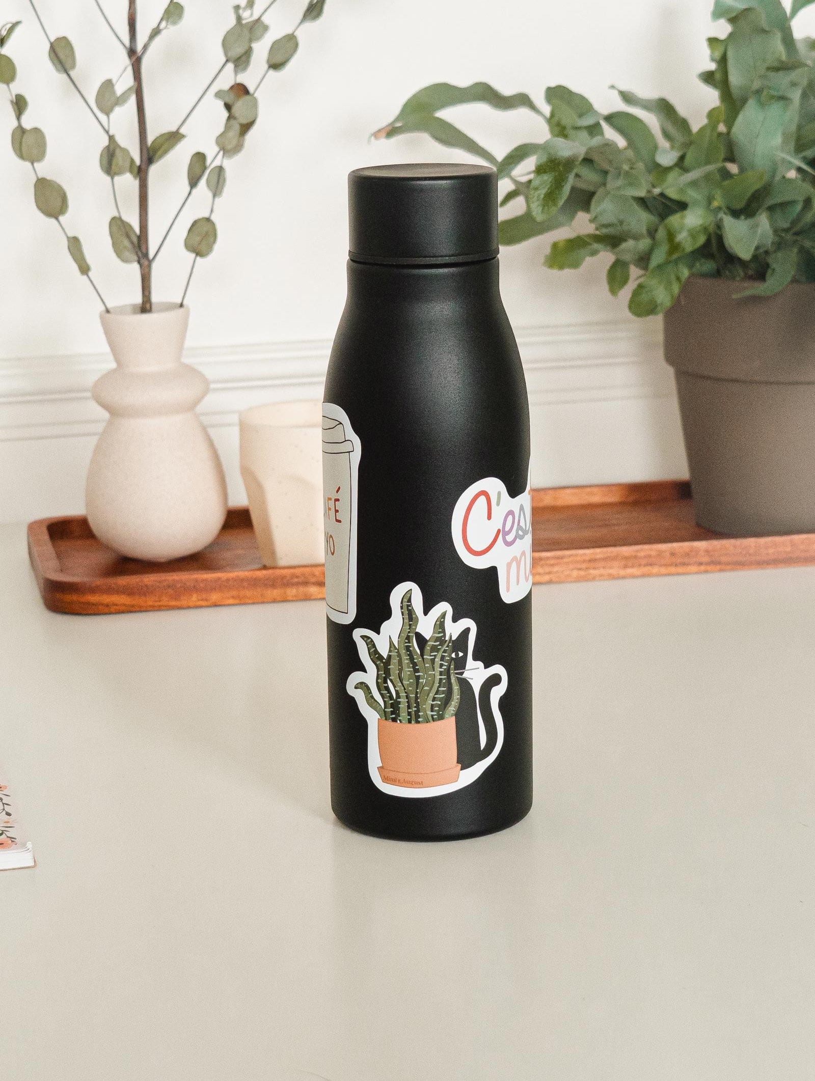 mimi and august sticker in water bottle