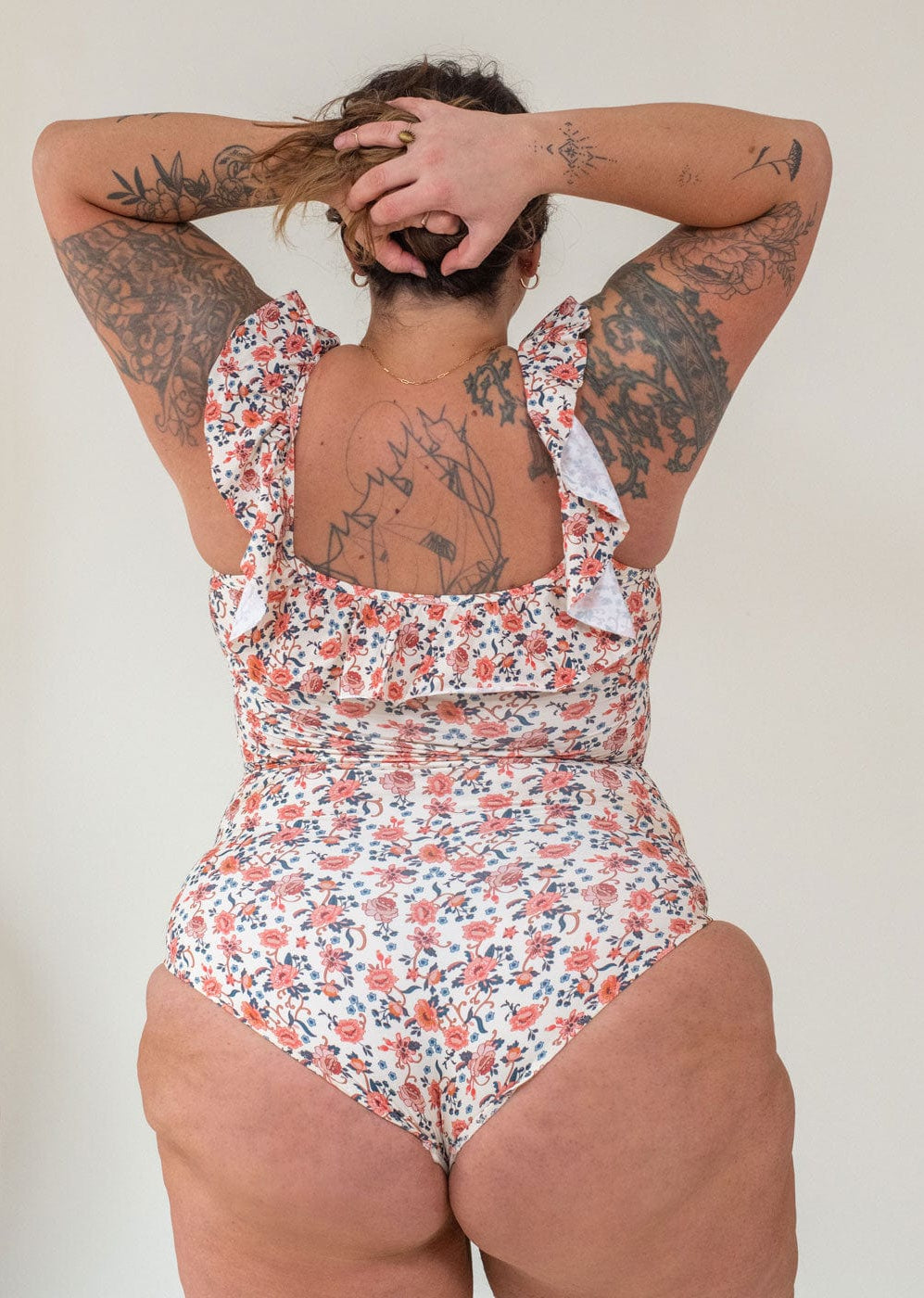 Back of Petra wearing the milano one piece floral