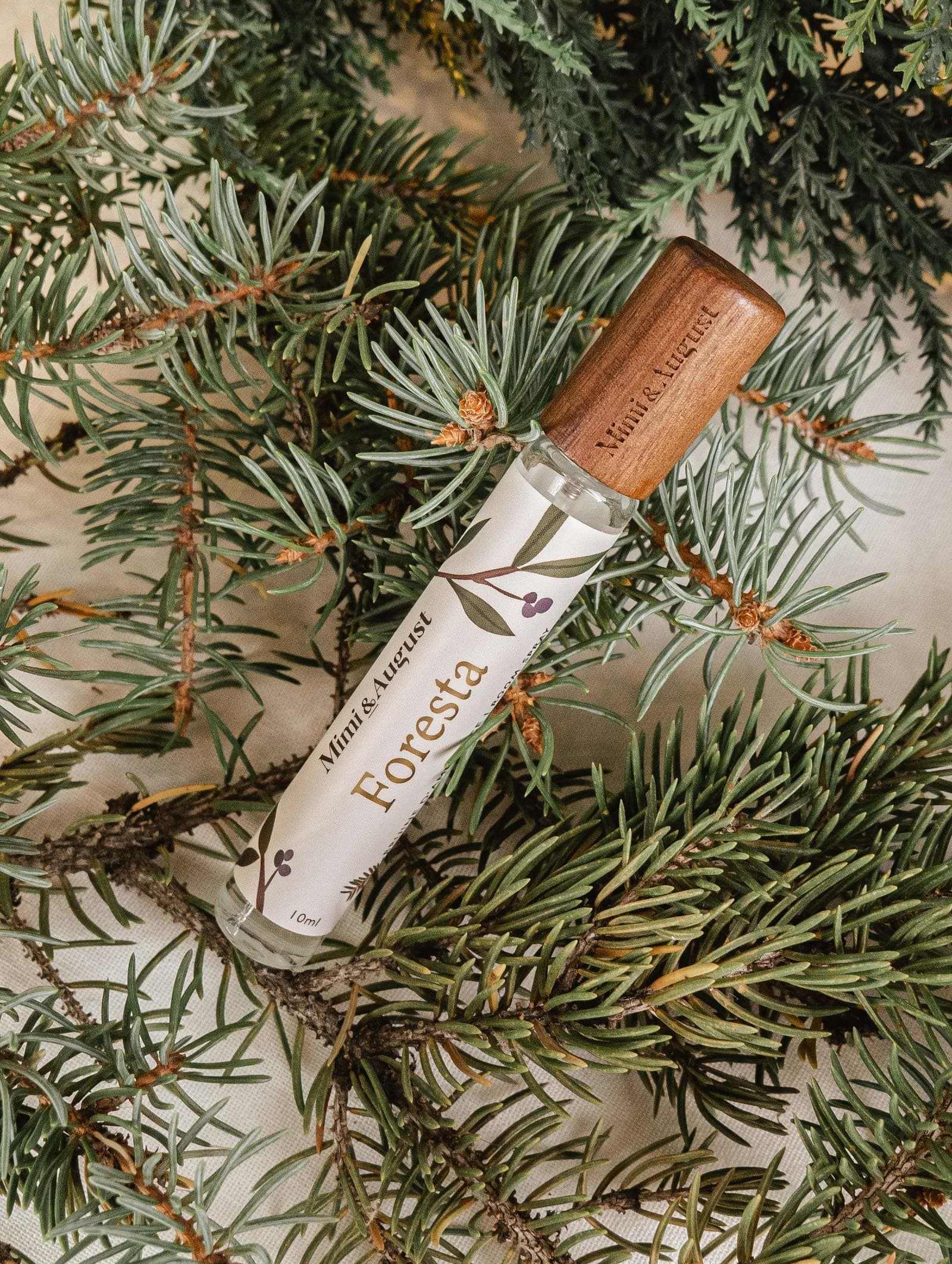 Foresta forest room spray with wooden cap on fir tree branches for a fresh, grounding scent