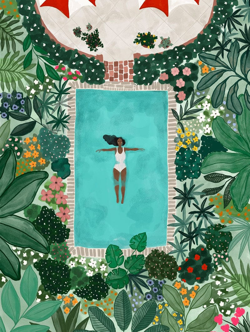 Illustration of a woman floating in a blue pool surrounded by lush green plants and colorful flowers. The scene includes partial views of red umbrellas and a stone path at the top of the image, rendered on high quality paper for stunning detail and durability. This is the Summer Day Art Print by Mimi & August.