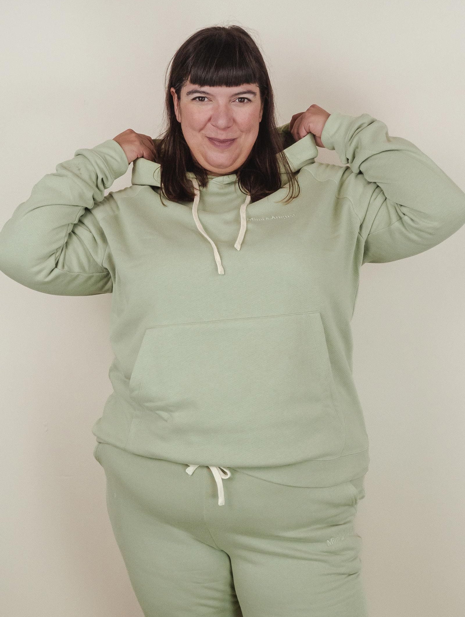 Stephanie is wearing a 3XL agave hoodie for a regular look.