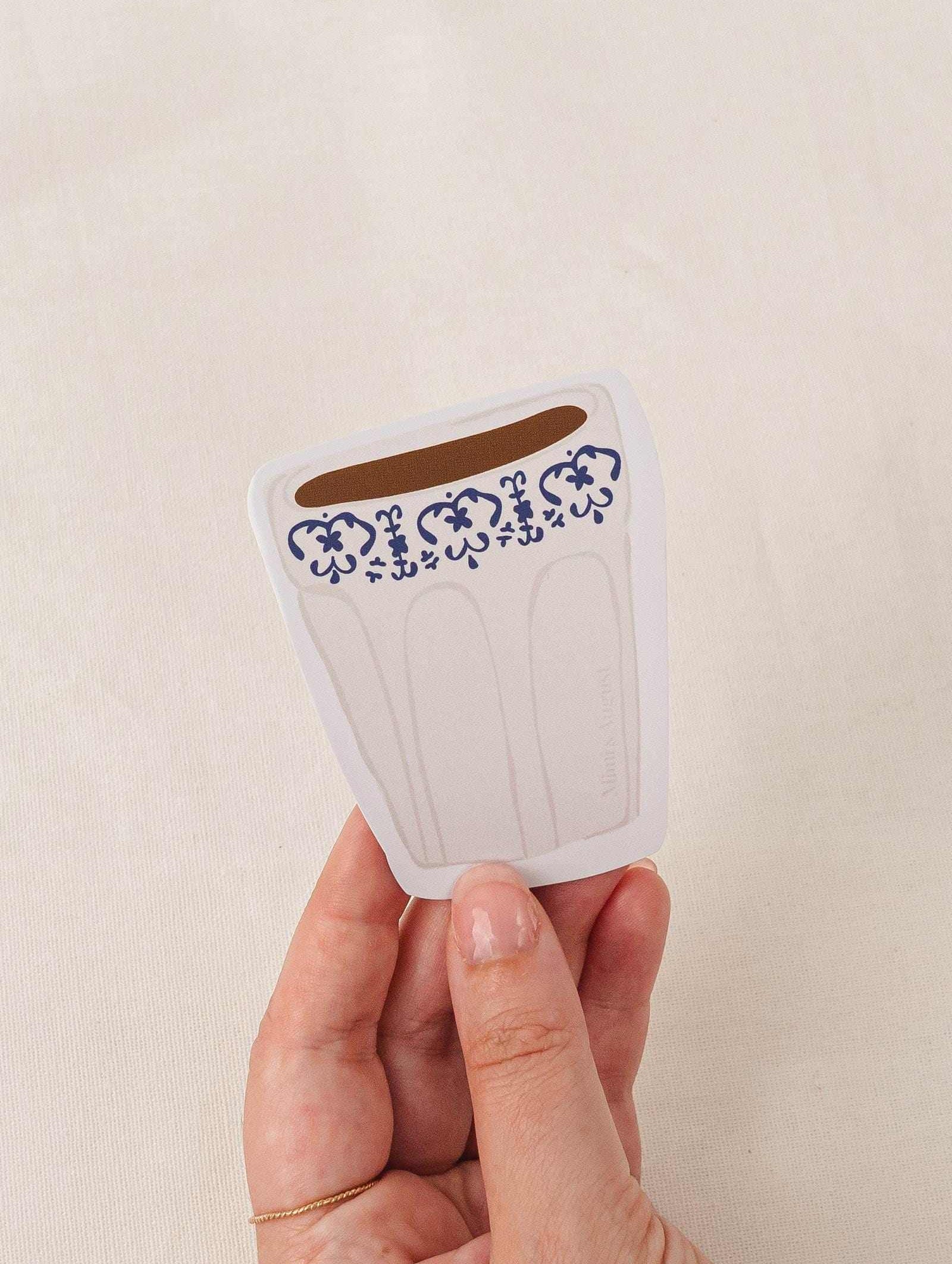 Cafe Latte vinyl sticker with decorative blue pattern held in hand, matte finish, durable and water-resistant design