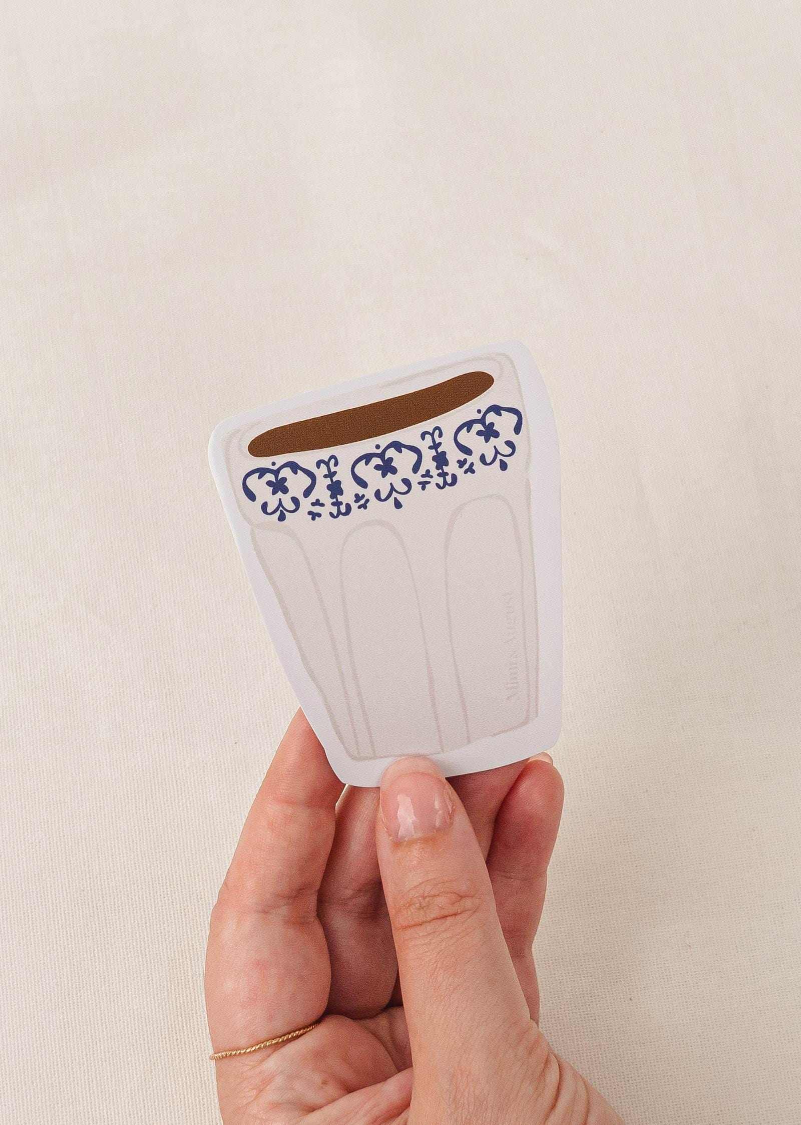 Cafe Latte vinyl sticker with decorative blue pattern held in hand, matte finish, durable and water-resistant design