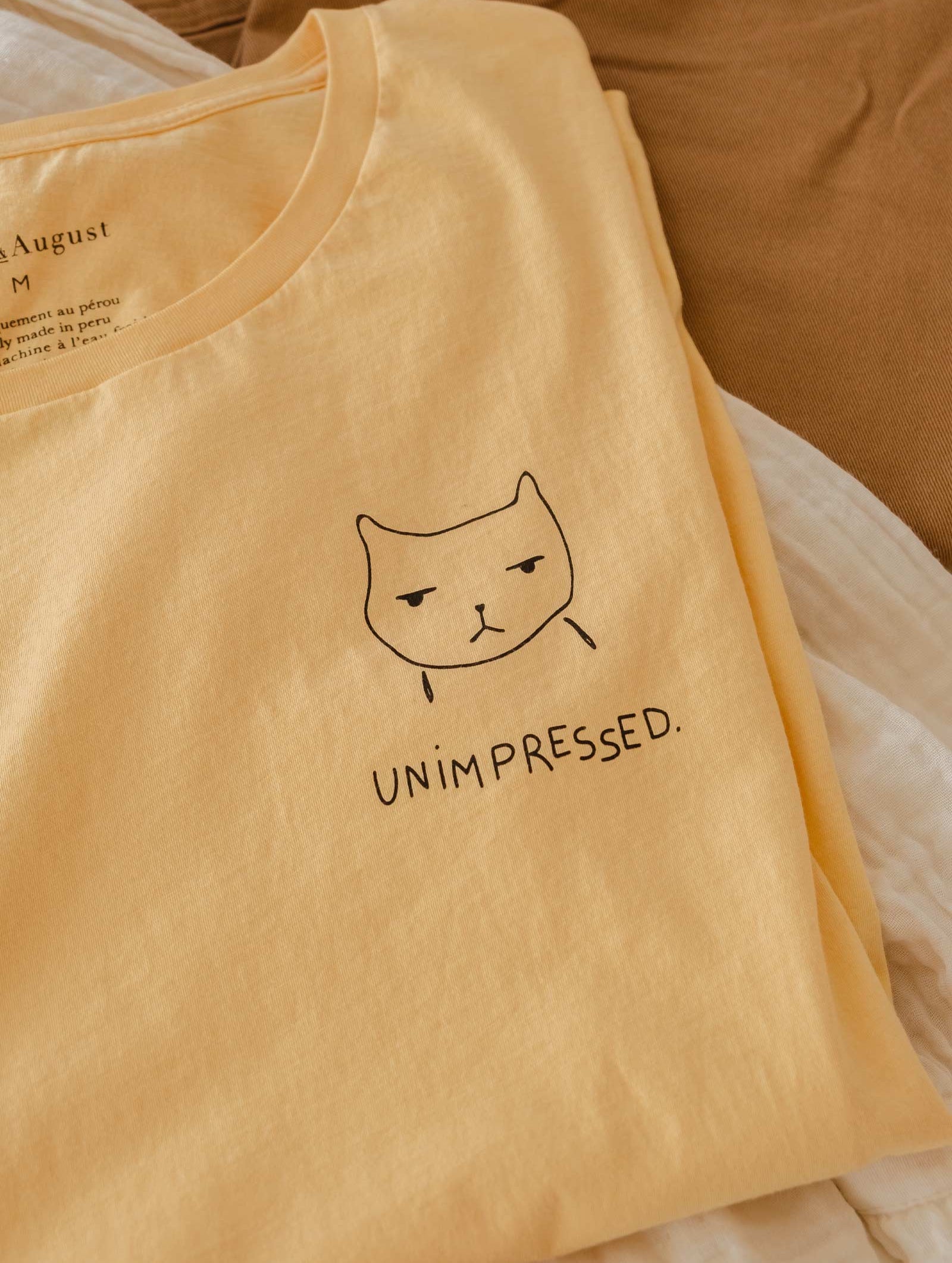 pima cotton t shirt with an illustration of a cat unimpressed created par mimi and august