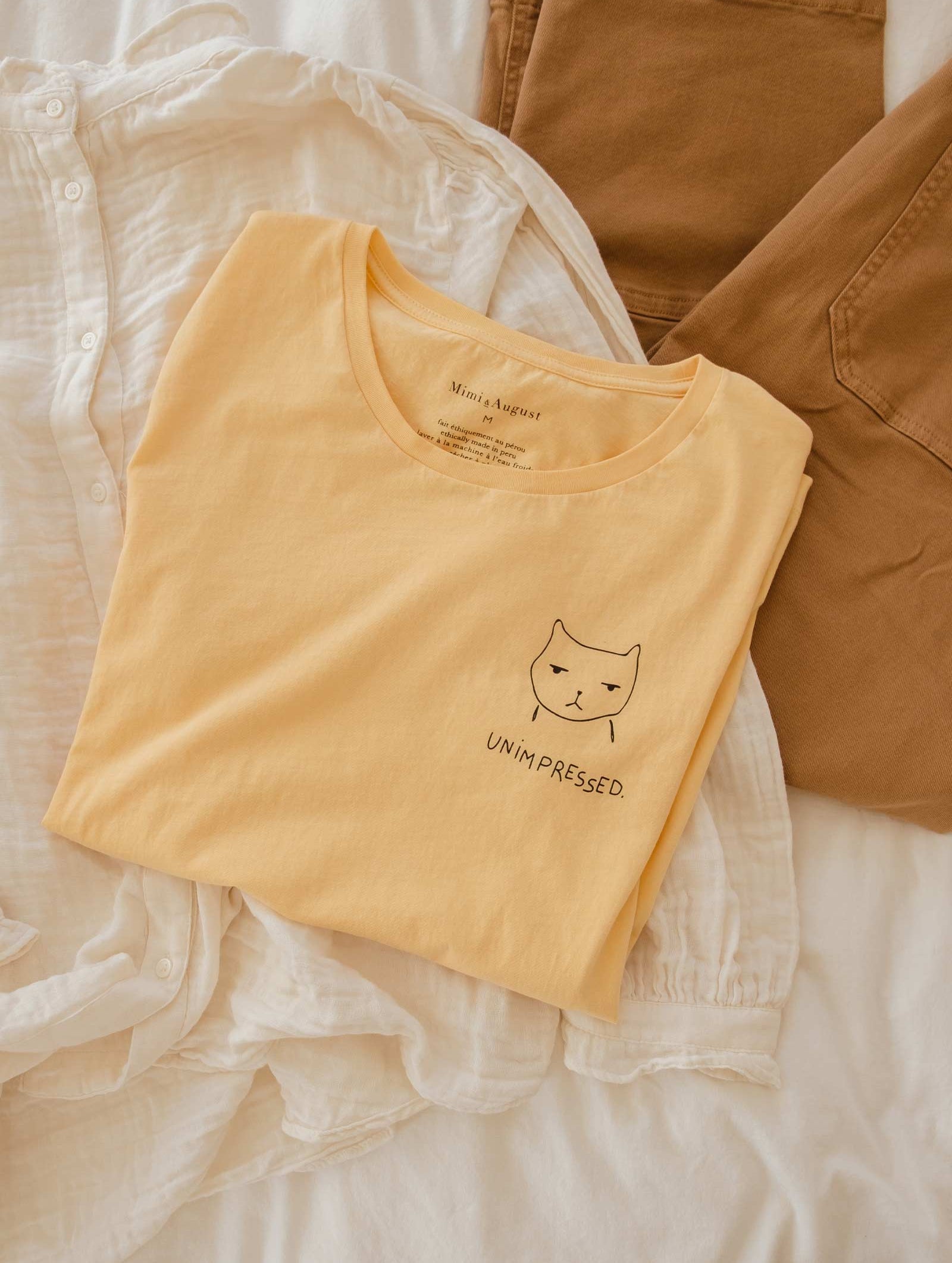 unimpressed cat illustration t-shirt made by mimi and august
