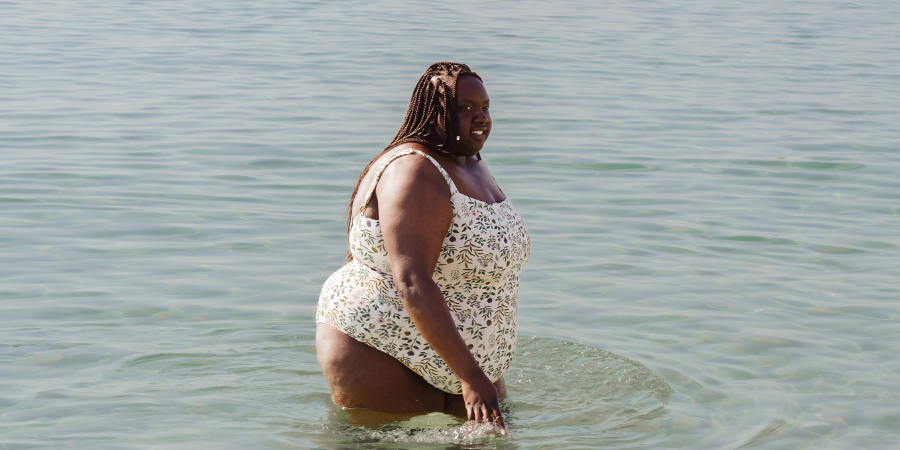 women in the beach wearing the nohea herboria one piece by mimi and august