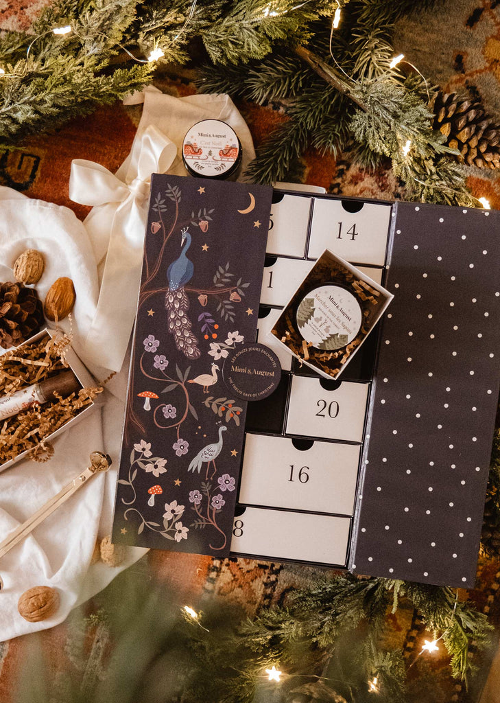 A "The Twelve Enchanted Days" Advent Calendar with scented candles and a rug, by Mimi & August.