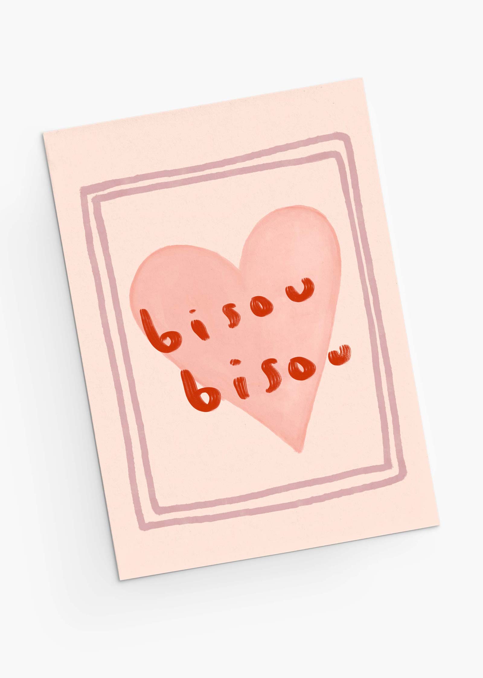 The Bisou Bisou Greeting Card from Mimi & August is made of recycled paper, showcasing a pink heart with "bisou bisou" in orange script at the center. Its simple border enhances its charm, making it ideal for sending love on Valentine's Day.